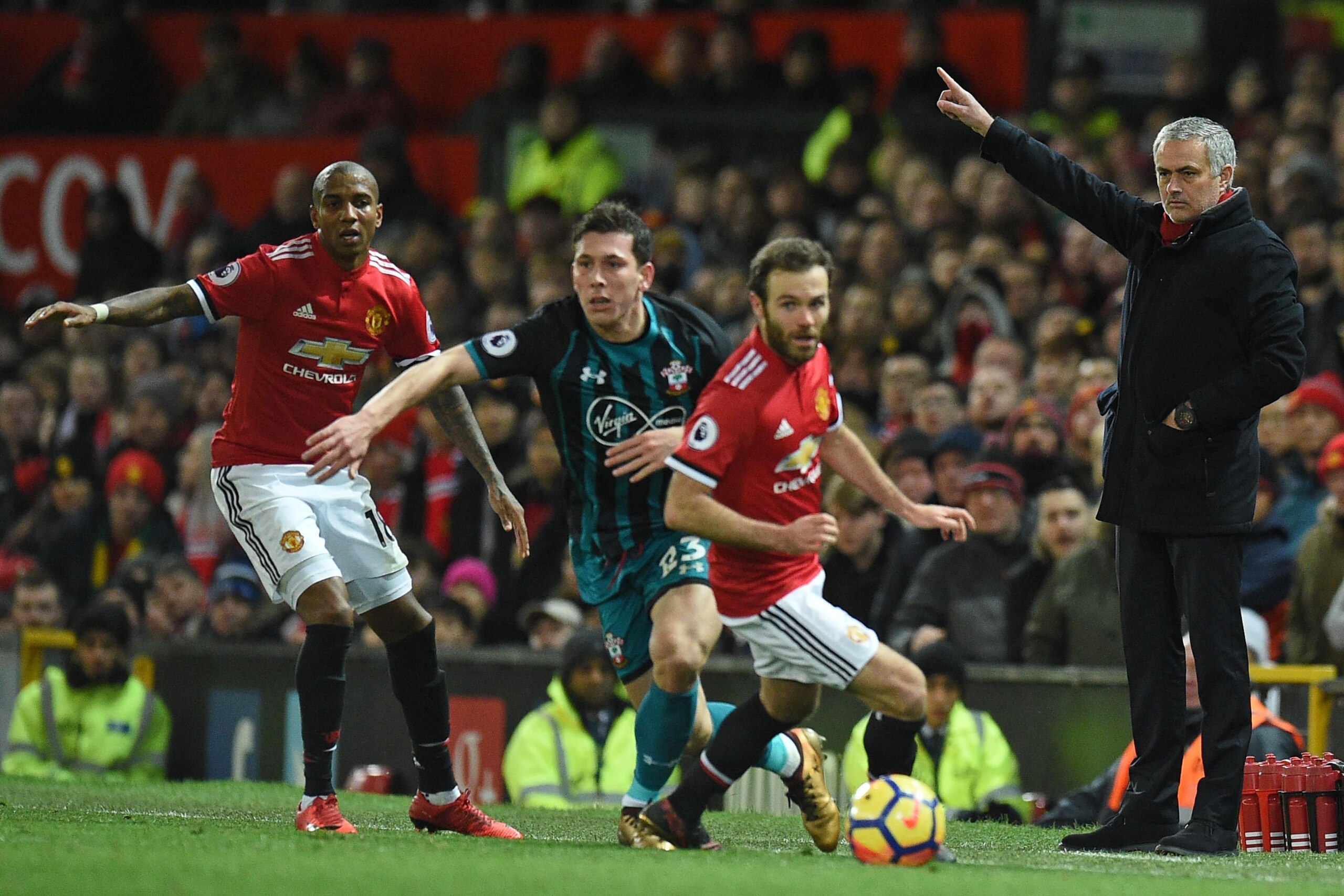 Manchester United's Portuguese manager Jose Mourinho (R) gestures on the touchline during the English Premier League football match between Manchester United and Southampton at Old Trafford in Manchester, north west England, on December 30, 2017. / AFP PH