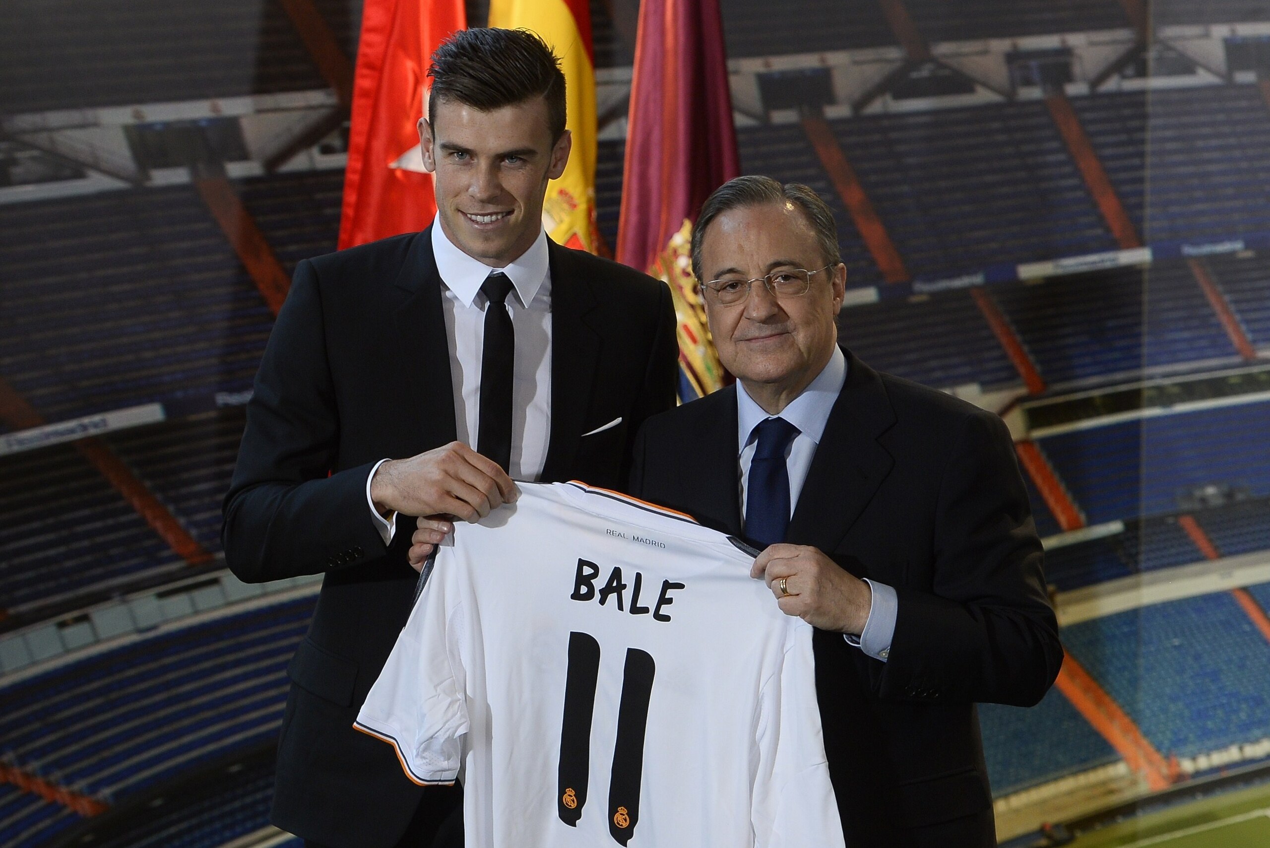 New Welsh striker Gareth Bale of Real Madrid (L) poses with his new jersey next to Real Madrid's President Florentino Perez during his presentation at the Santiago Bernabeu stadium in Madrid on September 2, 2013. Bale was unveiled as a Real Madrid player New Welsh striker Gareth Bale of Real Madrid (L) poses with his new jersey next to Real Madrid's President Florentino Perez during his presentation at the Santiago Bernabeu stadium in Madrid on September 2, 2013. Bale was unveiled as a Real Madrid player