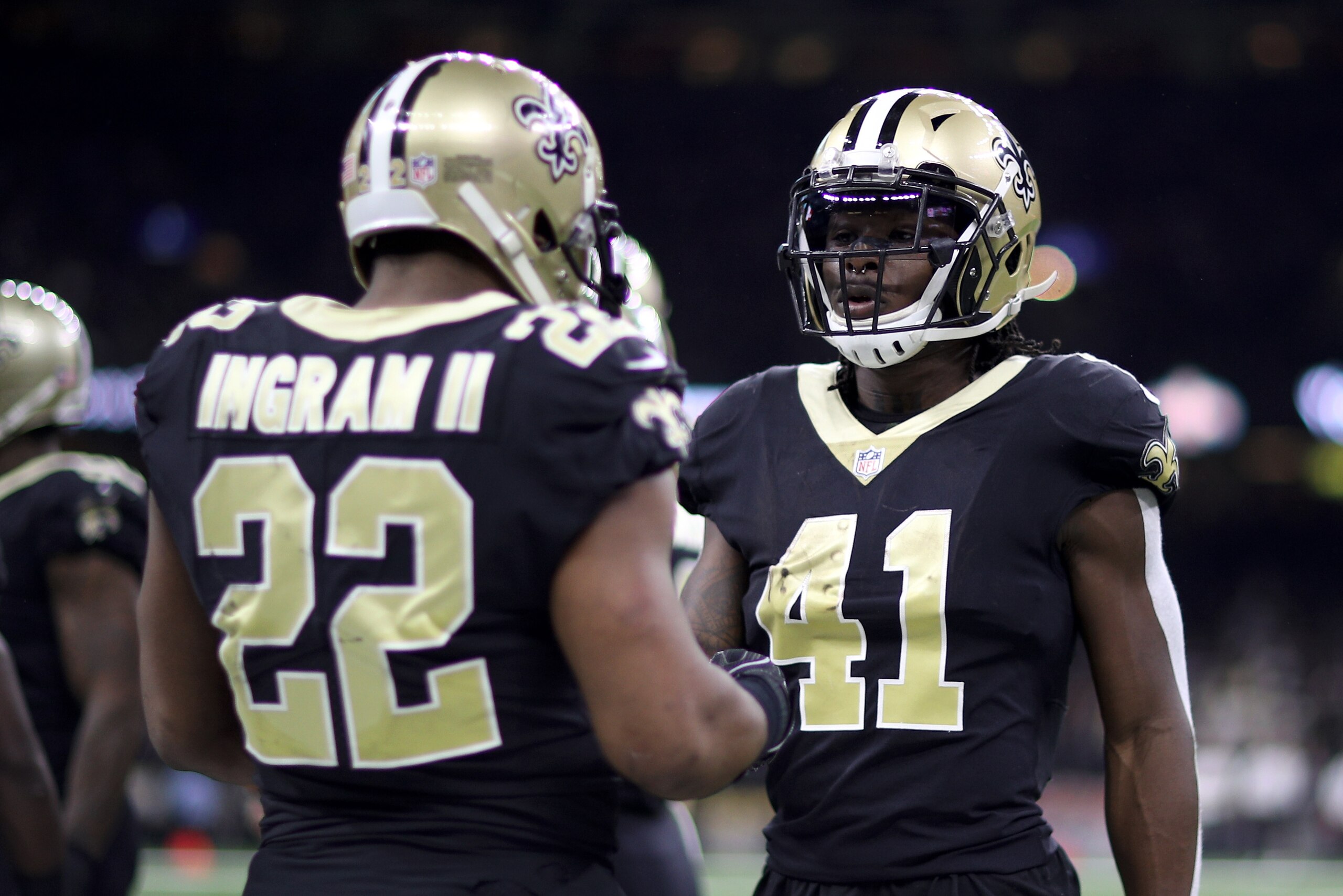 NEW ORLEANS, LA - DECEMBER 24:  Alvin Kamara #41 of the New Orleans Saints and  Mark Ingram #22 of the New Orleans Saints talk during the game against the Atlanta Falcons at Mercedes-Benz Superdome on December 24, 2017 in New Orleans, Louisiana.  (Photo b