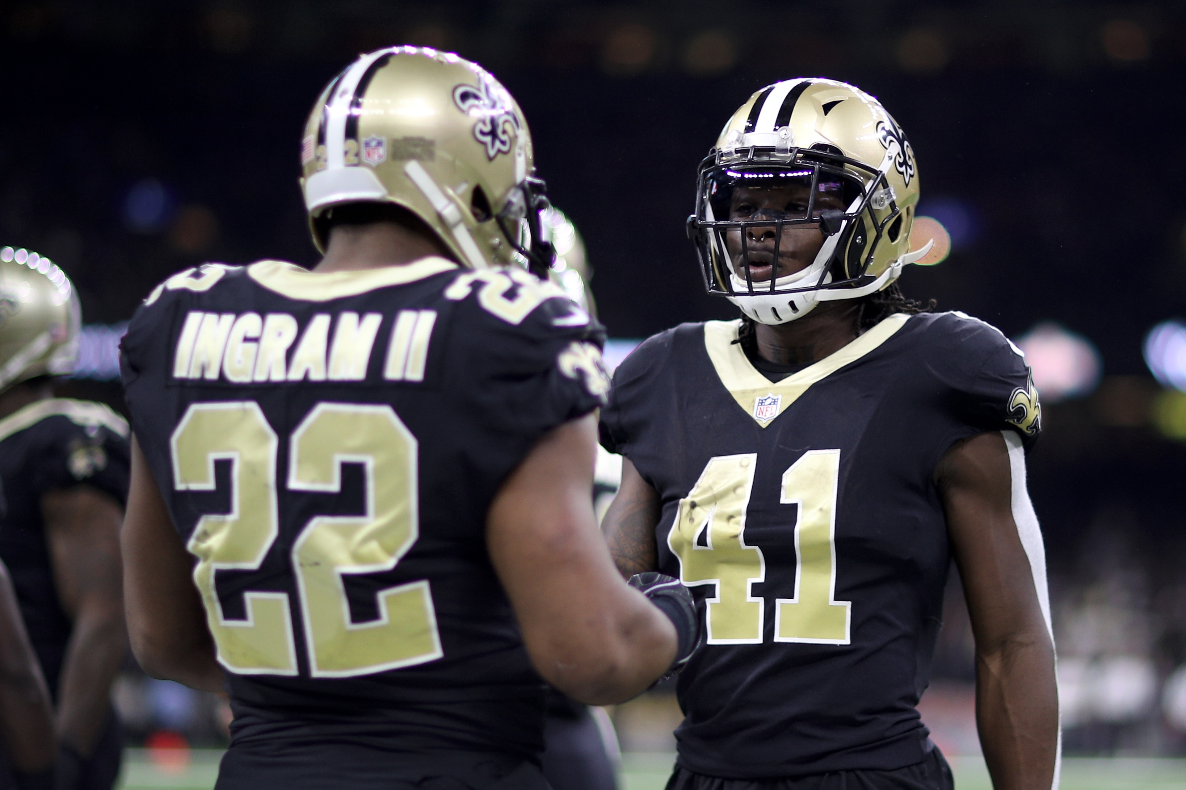 NEW ORLEANS, LA - DECEMBER 24:  Alvin Kamara #41 of the New Orleans Saints and  Mark Ingram #22 of the New Orleans Saints talk during the game against the Atlanta Falcons at Mercedes-Benz Superdome on December 24, 2017 in New Orleans, Louisiana.  (Photo b