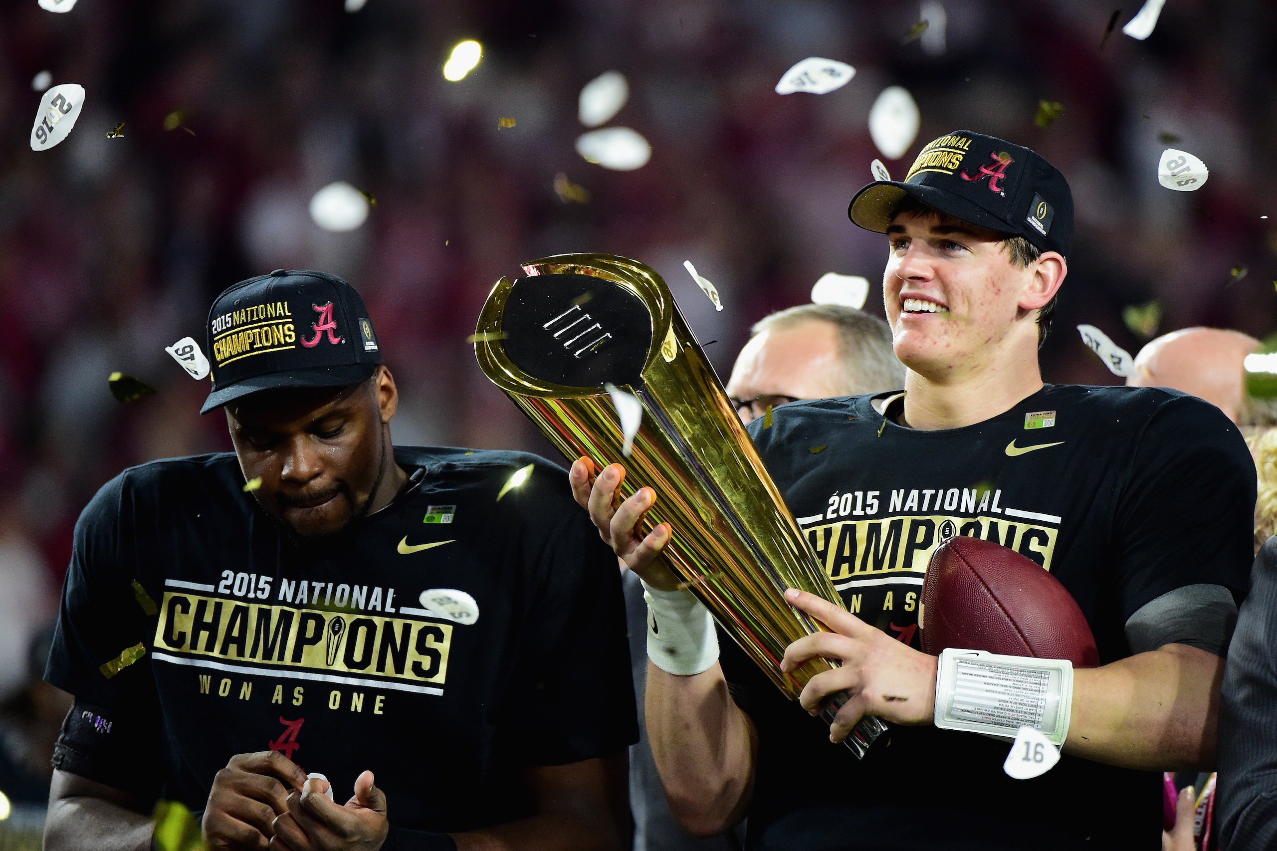 GLENDALE, AZ - JANUARY 11:  Jake Coker #14 of the Alabama Crimson Tide celebrates by hoisting the College Football Playoff National Championship Trophy after defeating the Clemson Tigers in the 2016 College Football Playoff National Championship Game at U