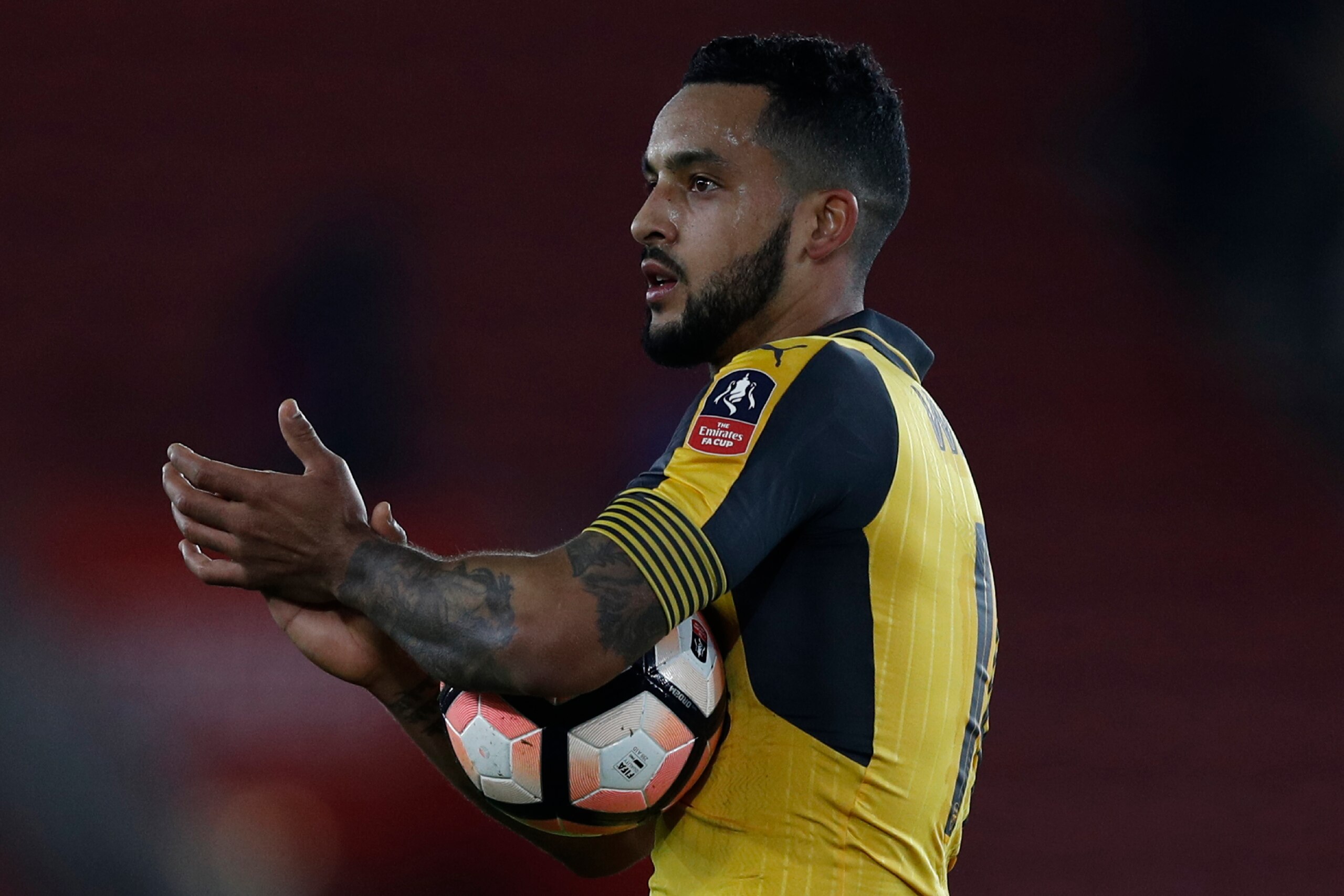 Arsenal's English midfielder Theo Walcott applauds the fans following the English FA Cup fourth round football match between Southampton and Arsenal at St Mary's in Southampton, southern England on January 28, 2017.
Arsenal won the match 5-0. / AFP / Adri