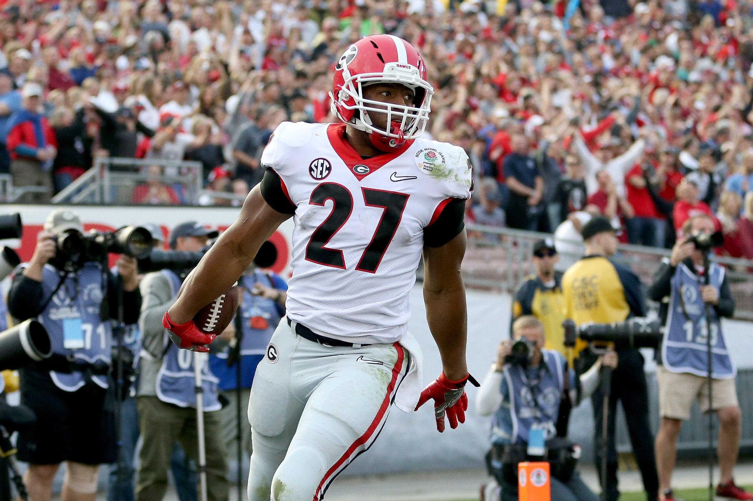 PASADENA, CA - JANUARY 01:  Nick Chubb #27 of the Georgia Bulldogs celebrates after a 50-yard touchdown in the third quarter in the 2018 College Football Playoff Semifinal Game against the Oklahoma Sooners at the Rose Bowl Game presented by Northwestern M