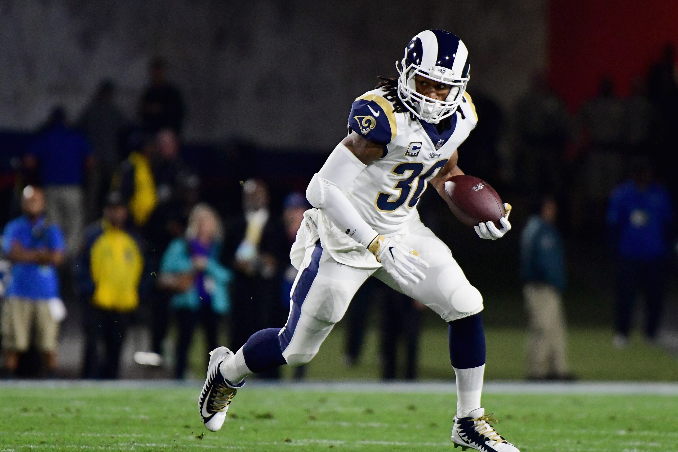 LOS ANGELES, CA - JANUARY 06: Running back Todd Gurley #30 of the Los Angeles Rams runs with the ball after taking a hand off during the first quarter of the NFC Wild Card Playoff game against the Atlanta Falcons at Los Angeles Coliseum on January 6, 201 LOS ANGELES, CA - JANUARY 06: Running back Todd Gurley #30 of the Los Angeles Rams runs with the ball after taking a hand off during the first quarter of the NFC Wild Card Playoff game against the Atlanta Falcons at Los Angeles Coliseum on January 6, 201