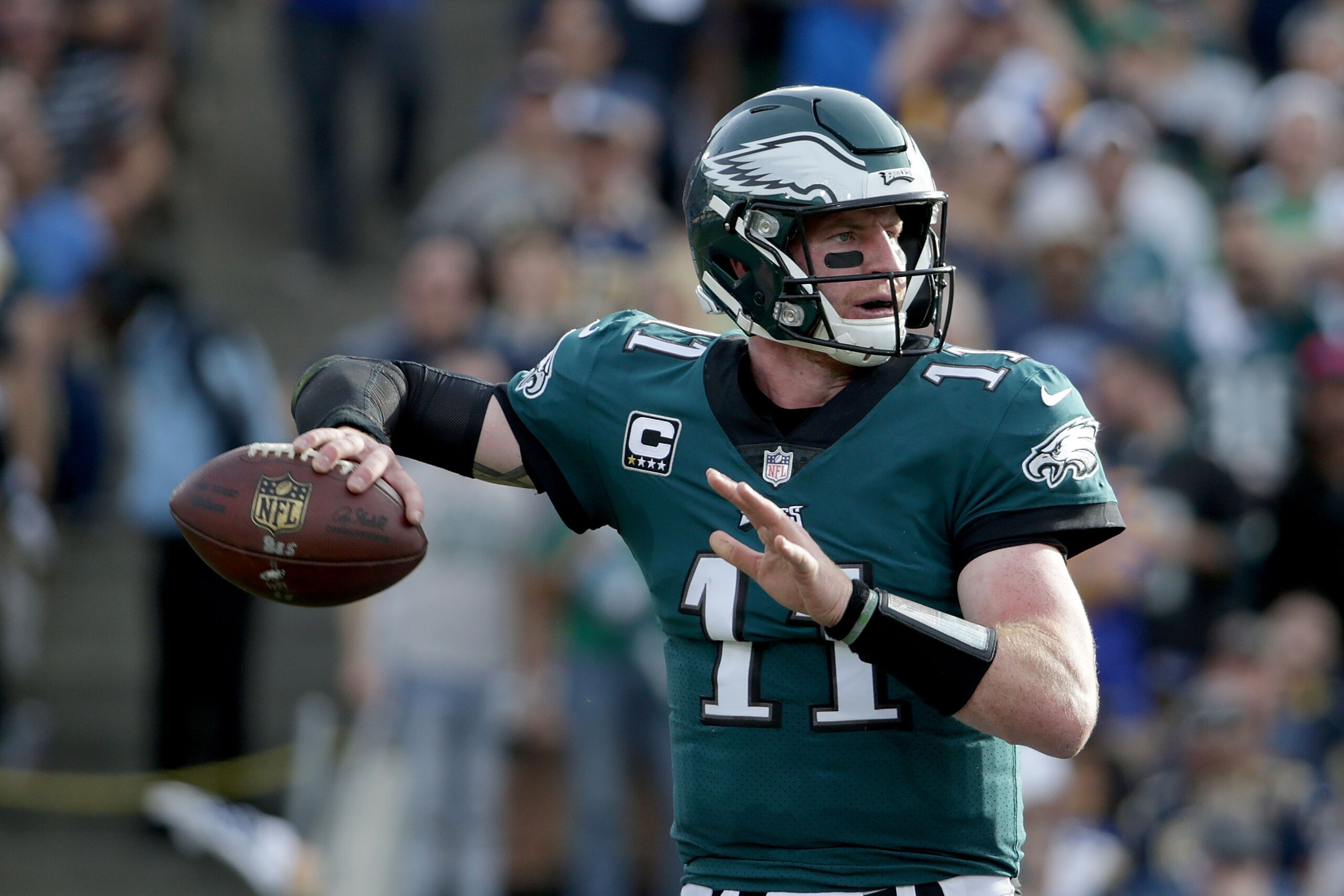 LOS ANGELES, CA - DECEMBER 10: Quarterback Carson Wentz #11 of the Philadelphia Eagles drops back to pass against the Los Angeles Rams during the second quarter at Los Angeles Memorial Coliseum on December 10, 2017 in Los Angeles, California. The Eagles LOS ANGELES, CA - DECEMBER 10: Quarterback Carson Wentz #11 of the Philadelphia Eagles drops back to pass against the Los Angeles Rams during the second quarter at Los Angeles Memorial Coliseum on December 10, 2017 in Los Angeles, California. The Eagles