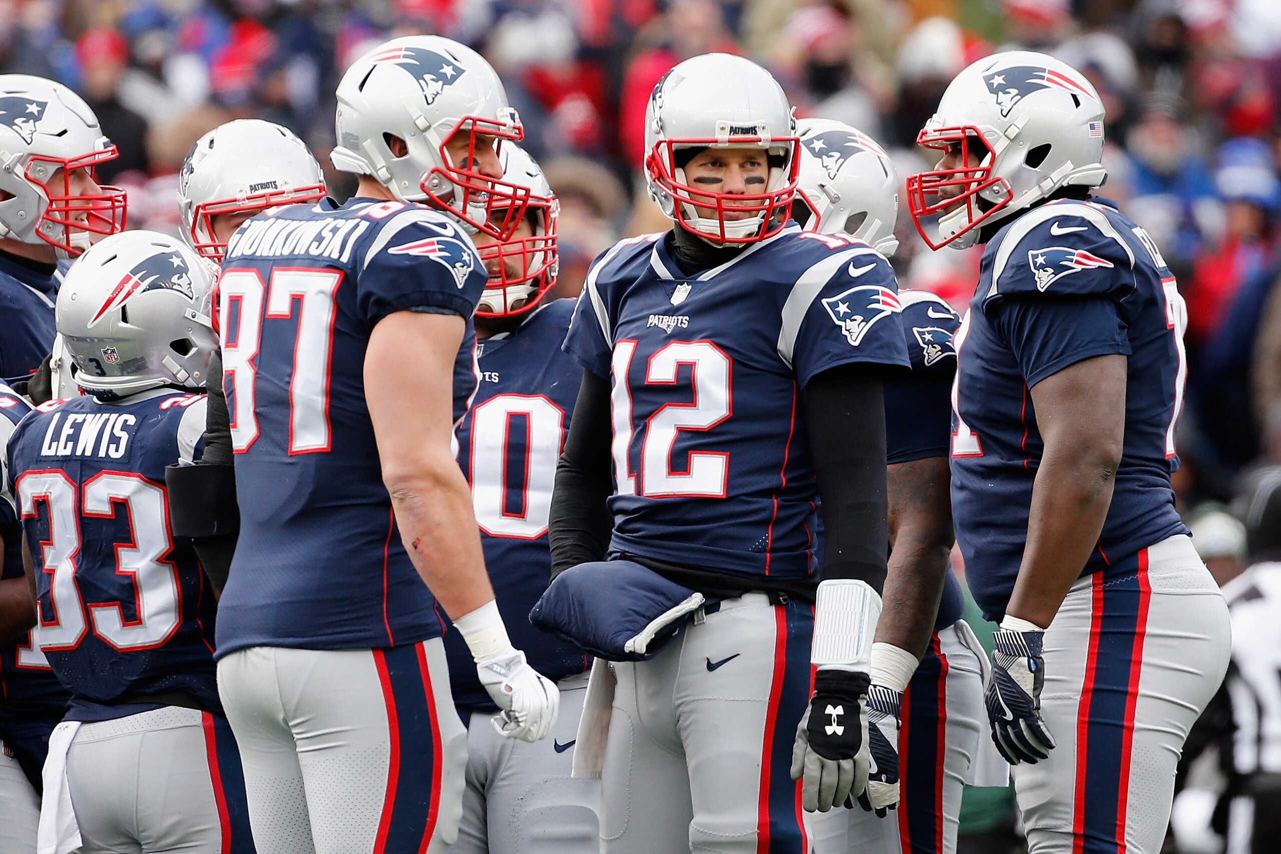 FOXBORO, MA - DECEMBER 31:  Tom Brady #12 of the New England Patriots huddles with teammates during the first half against the New York Jets at Gillette Stadium on December 31, 2017 in Foxboro, Massachusetts.  (Photo by Jim Rogash/Getty Images)