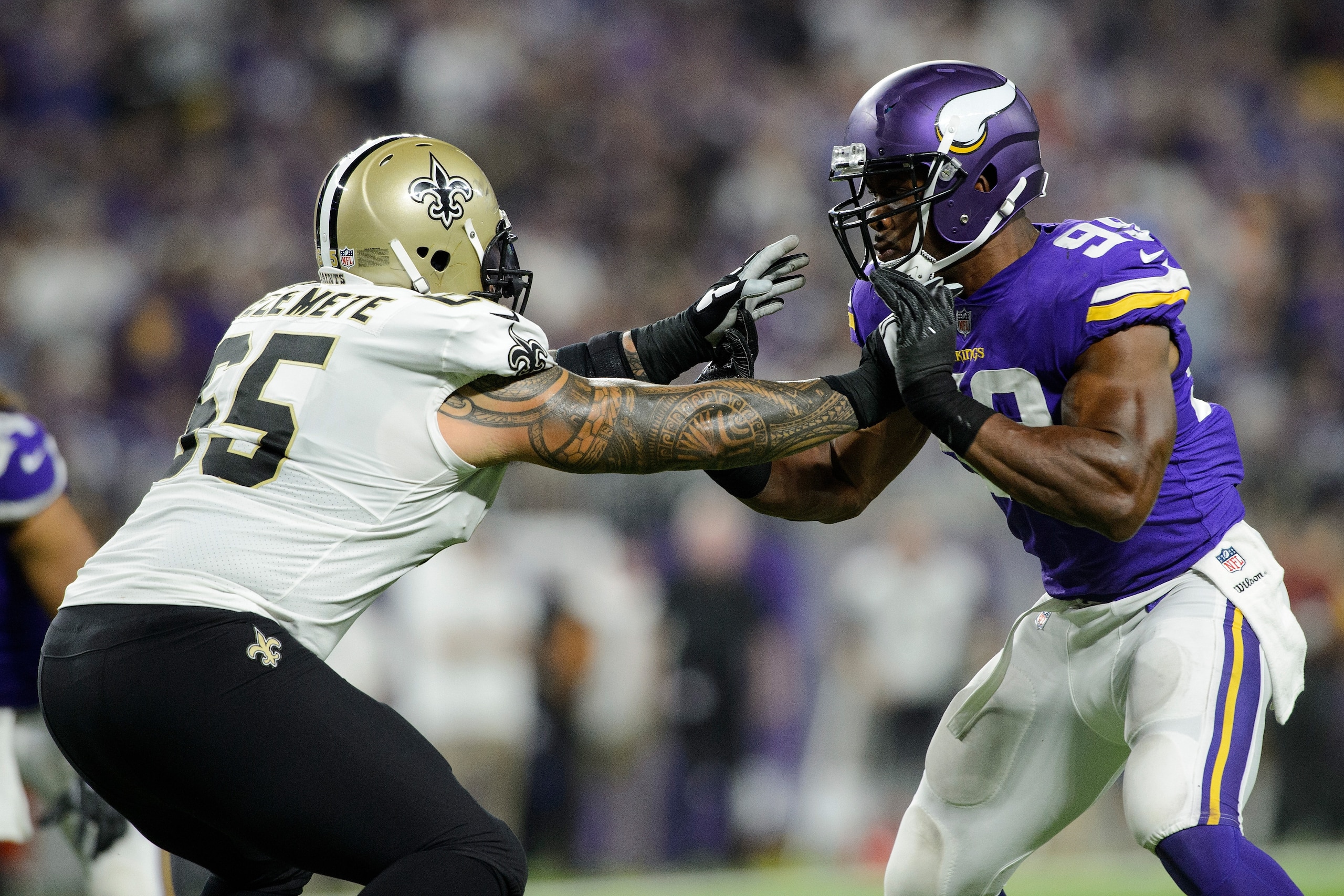 MINNEAPOLIS, MN - SEPTEMBER 11: Senio Kelemete #65 of the New Orleans Saints blocks Danielle Hunter #99 of the Minnesota Vikings during the game on September 11, 2017 at U.S. Bank Stadium in Minneapolis, Minnesota. The Vikings defeated the Saints 29-19. (