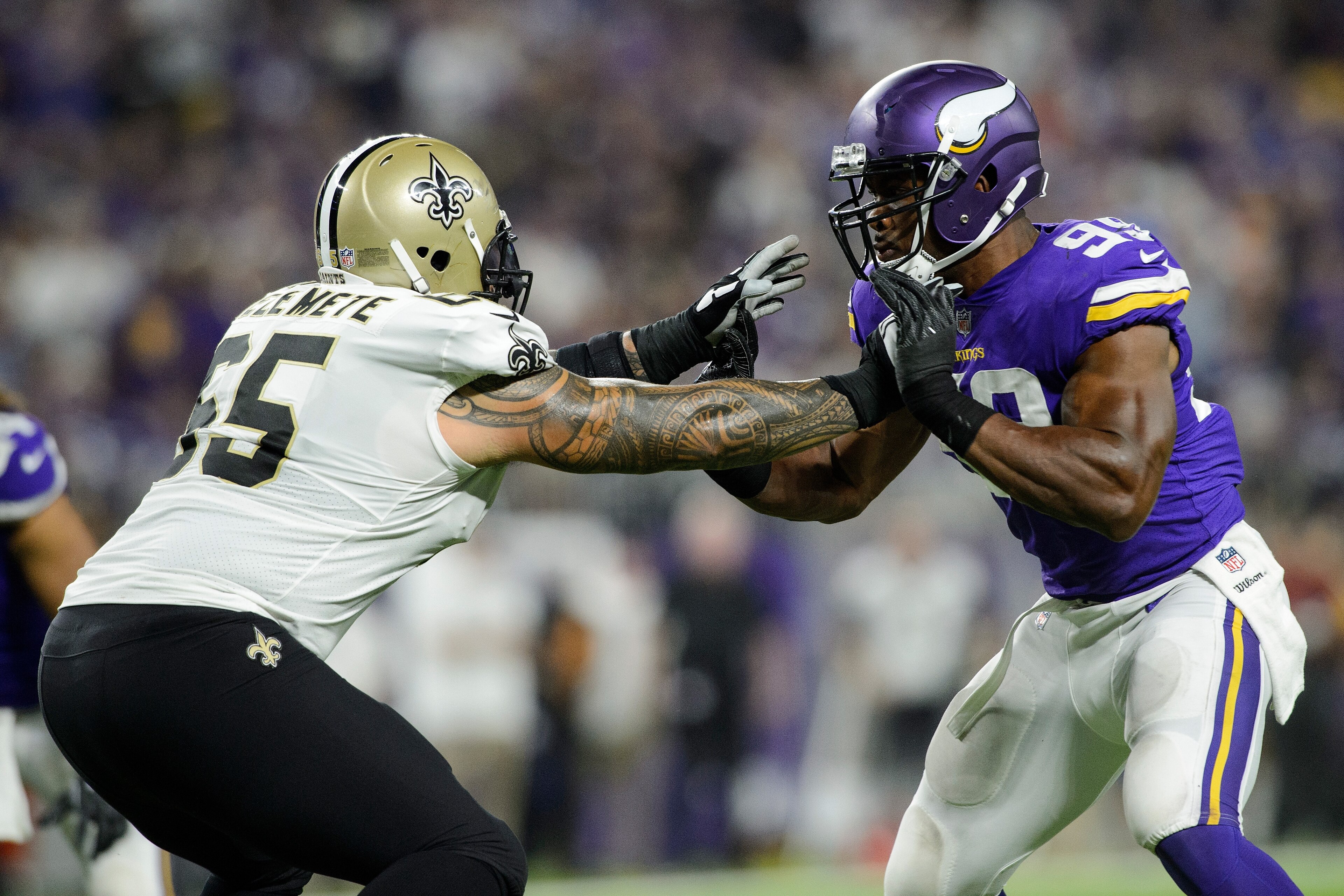 MINNEAPOLIS, MN - SEPTEMBER 11: Senio Kelemete #65 of the New Orleans Saints blocks Danielle Hunter #99 of the Minnesota Vikings during the game on September 11, 2017 at U.S. Bank Stadium in Minneapolis, Minnesota. The Vikings defeated the Saints 29-19. (