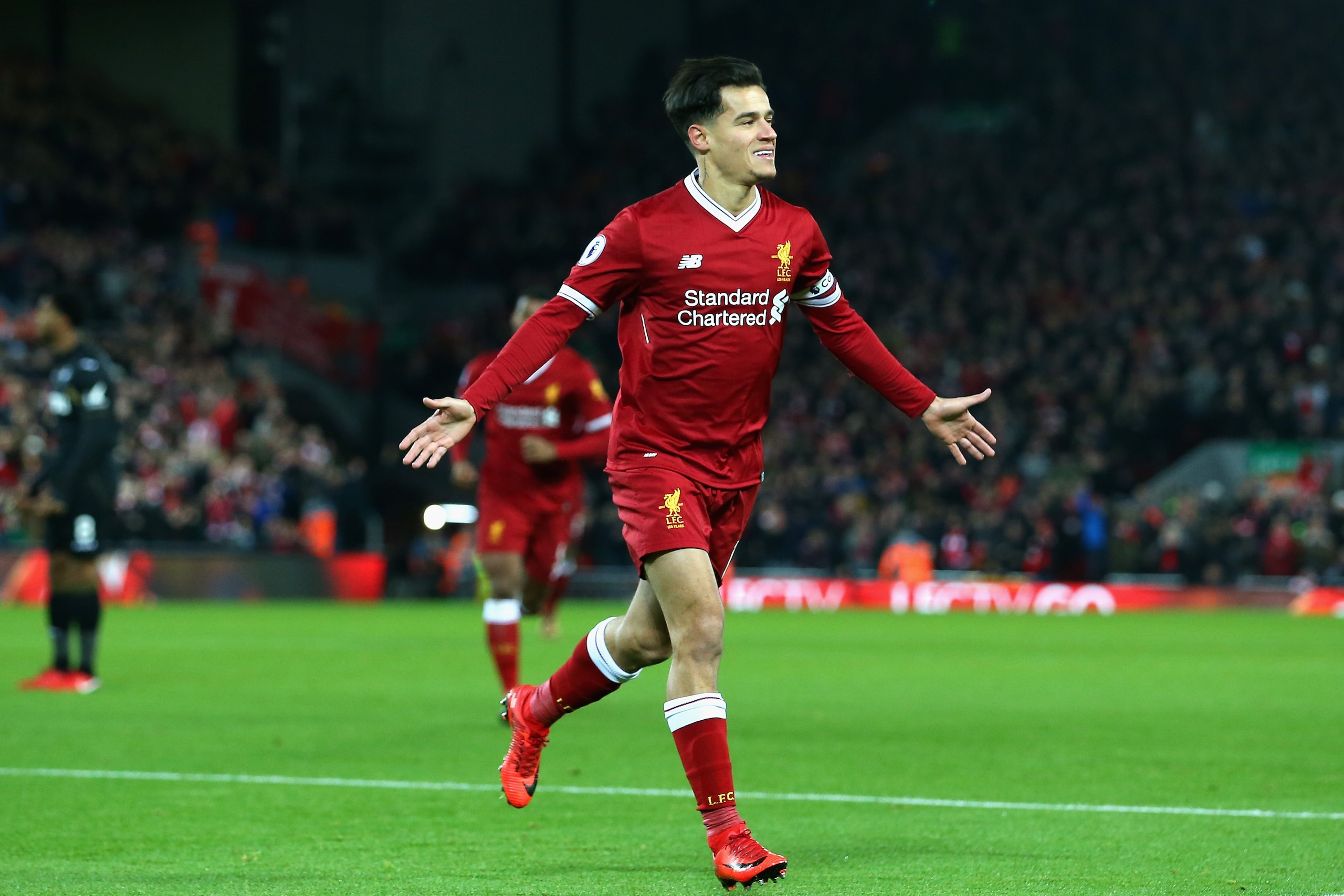 LIVERPOOL, ENGLAND - DECEMBER 26:  Philippe Coutinho of Liverpool scores his sides first goal during the Premier League match between Liverpool and Swansea City at Anfield on December 26, 2017 in Liverpool, England.  (Photo by Jan Kruger/Getty Images)