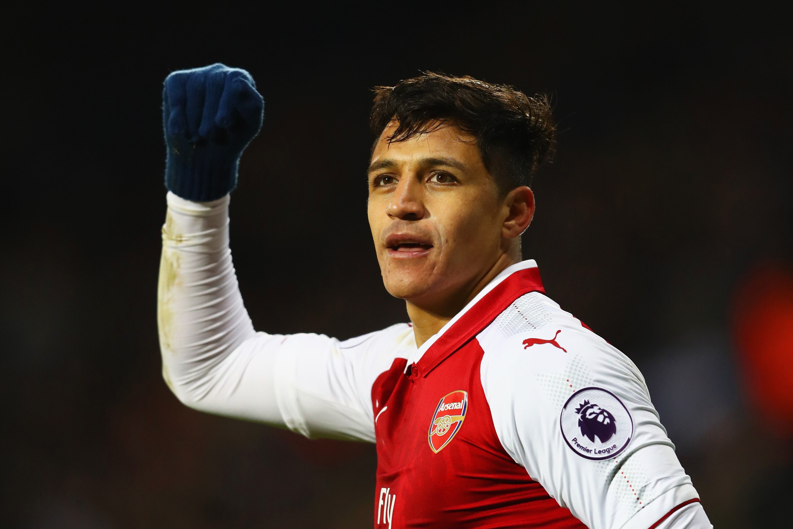 WEST BROMWICH, ENGLAND - DECEMBER 31:  Alexis Sanchez of Arsenal celebrates as his free kick deflects off James McClean of West Bromwich Albion for their first goal during the Premier League match between West Bromwich Albion and Arsenal at The Hawthorns 