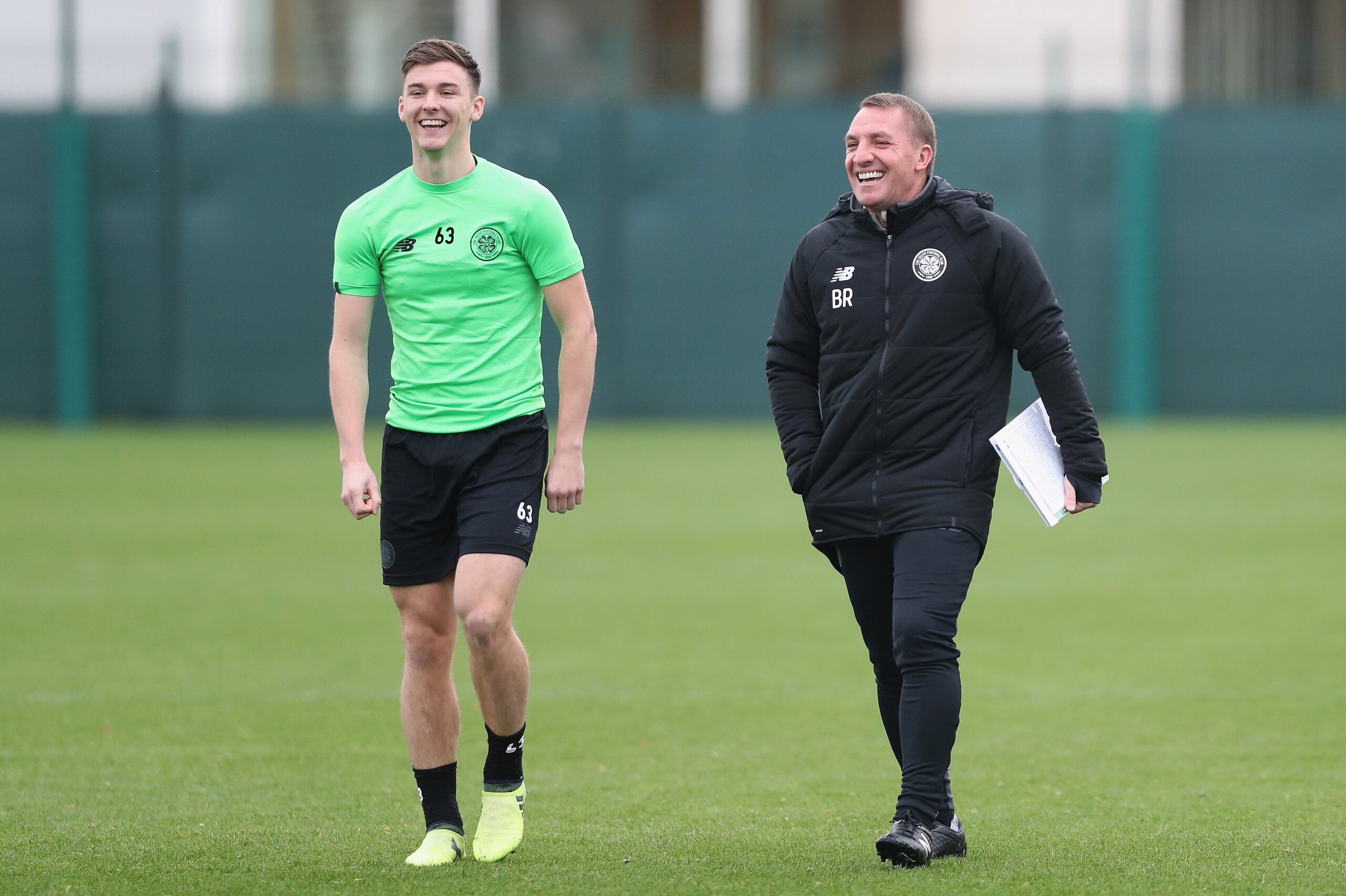 GLASGOW, SCOTLAND - OCTOBER 30:  Kieran Tierney of Celtic and Brendan Rodgers manager of Celtic share a joke as they walk out prior to the Celtic Training Session prior to the Group B UEFA Champions League match between Celtic and Bayern Muenchen on Octob