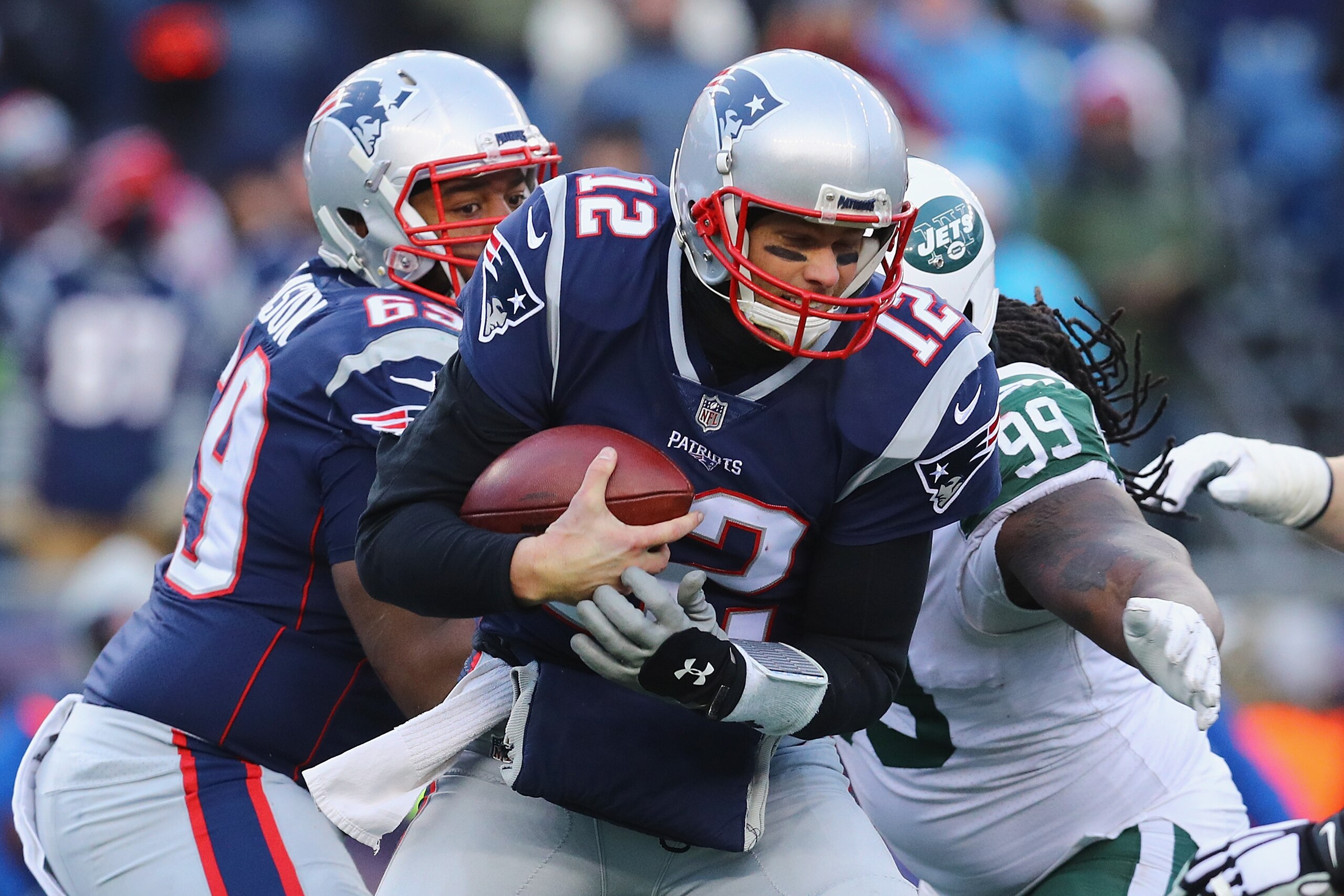 FOXBORO, MA - DECEMBER 31:  Steve McLendon #99 of the New York Jets sacks Tom Brady #12 of the New England Patriots during the second half at Gillette Stadium on December 31, 2017 in Foxboro, Massachusetts.  (Photo by Maddie Meyer/Getty Images)