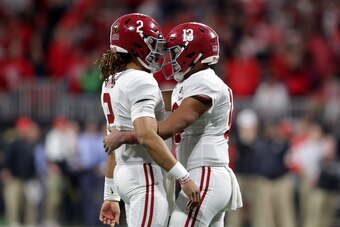 ATLANTA, GA - JANUARY 08: Tua Tagovailoa #13 celebrates a touchdown pass with Jalen Hurts #2 of the Alabama Crimson Tide during the third quarter against the Georgia Bulldogs in the CFP National Championship presented by AT&T at Mercedes-Benz Stadium on J
