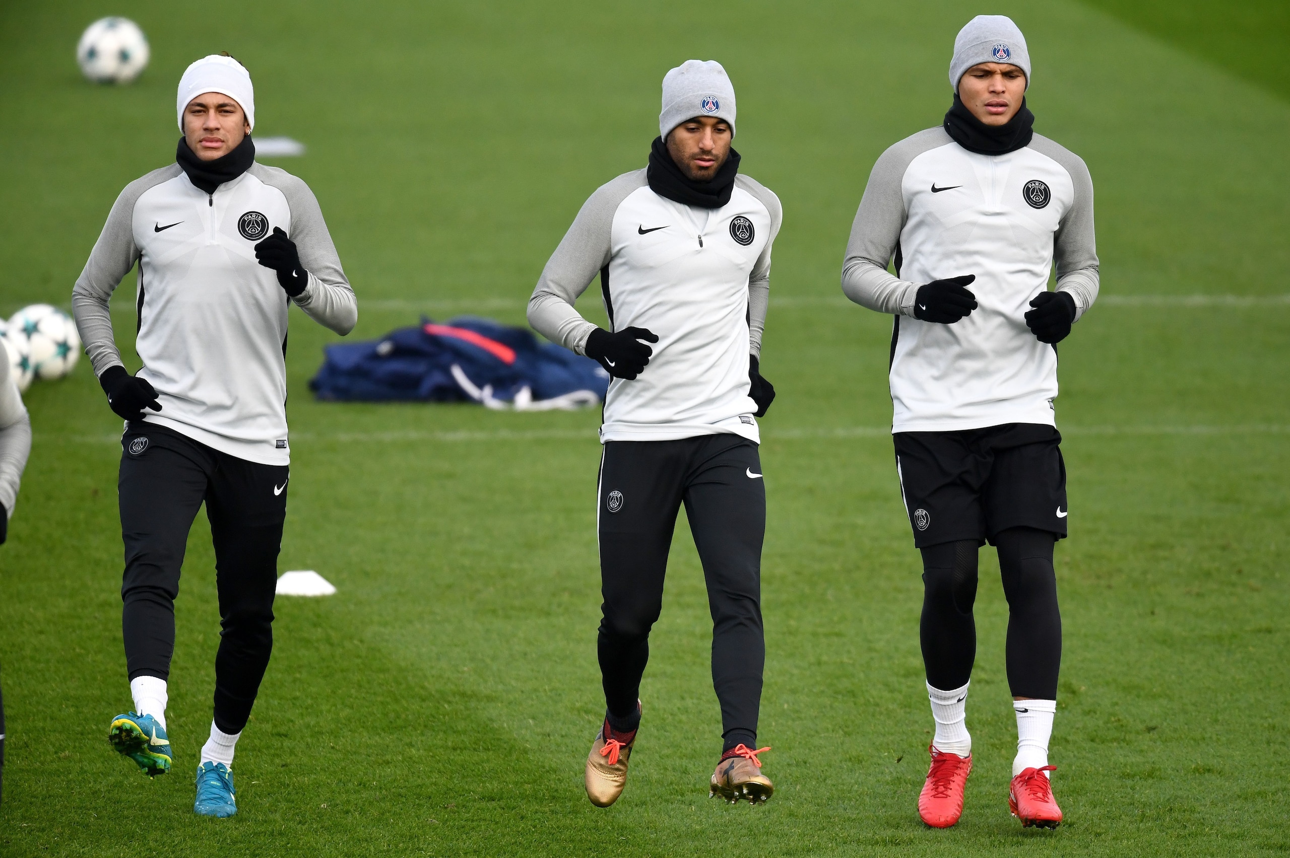 (L-R) Paris Saint-Germain's Brazilian forward Neymar, Brazilian midfielder Lucas Moura and Brazilian defender Thiago Silva take part in a training session in Saint-Germain-en-Laye, western Paris, on December 4, 2017, on the eve of the UEFA Champions Leagu