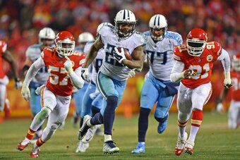 KANSAS CITY, MO - JANUARY 6:  Running back Derrick Henry #22 of the Tennessee Titans runs up field for a touchdown during the second half of the game against the Kansas City Chiefs at Arrowhead Stadium on January 6, 2018 in Kansas City, Missouri. (Photo b
