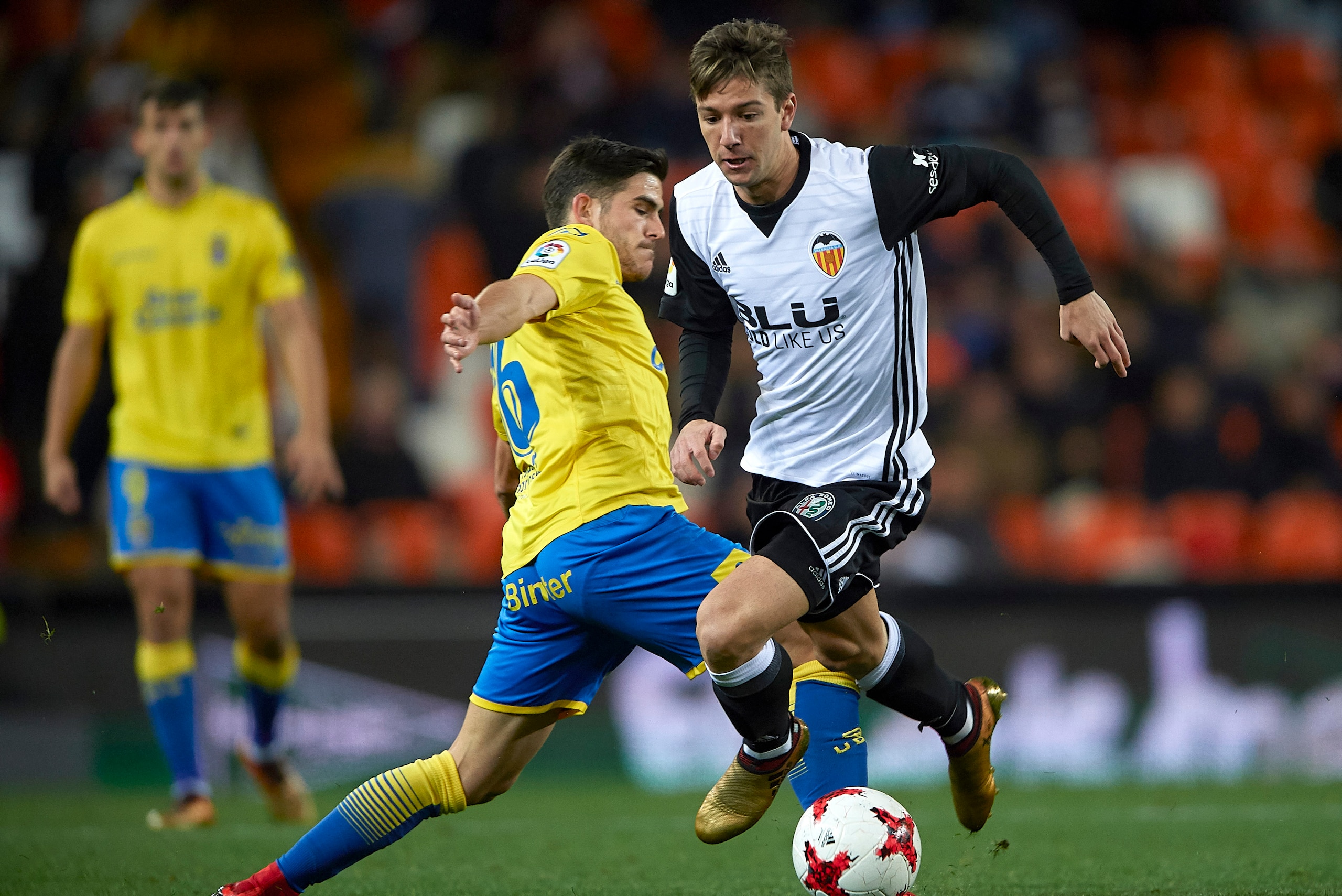 VALENCIA, SPAIN - JANUARY 09:  Luciano Vietto of Valencia is tackled by Aythami Artiles of Las Palmas during the Copa del Rey, Round of 16, second Leg match between Valencia CF and UD Las Palmas on January 9, 2018 in Valencia, Spain.  (Photo by fotopress/