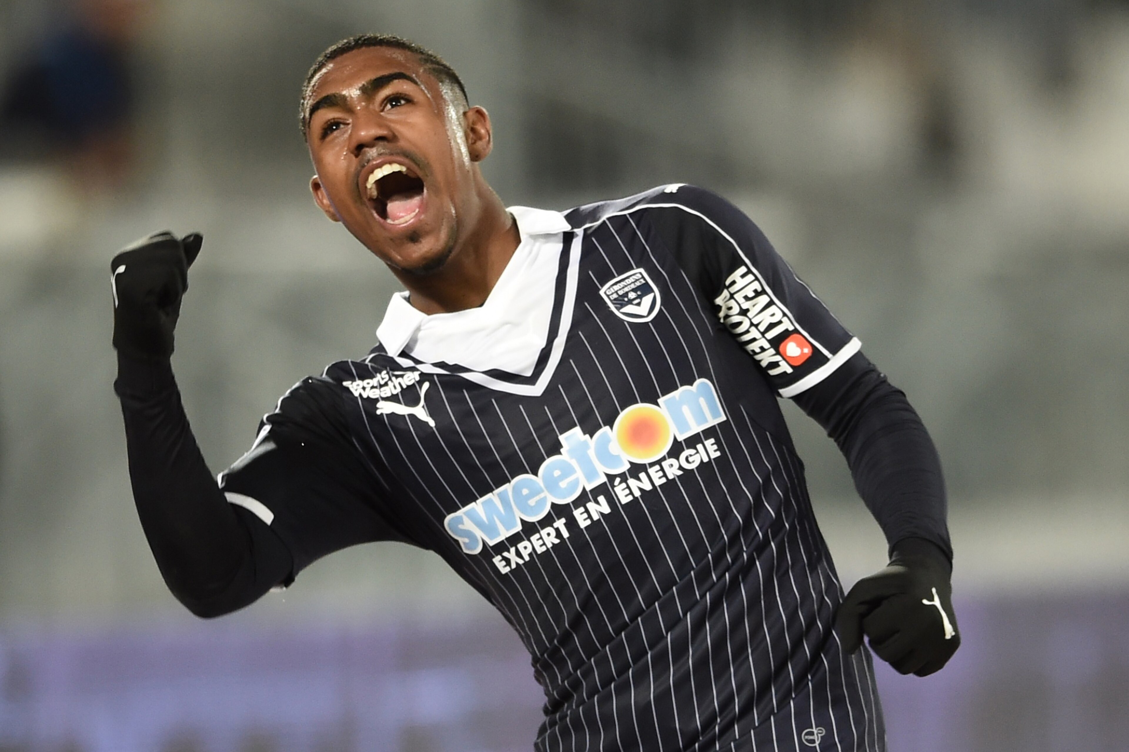 Bordeaux's Brazilian forward Malcom celebrates after scoring a goal during the French L1 football match between Bordeaux (FCGB) and Montpellier on March 18, 2017 at the Matmut Atlantique stadium in Bordeaux, southwestern France. / AFP PHOTO / NICOLAS TUCA