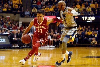MORGANTOWN, WV - JANUARY 06:  Trae Young #11 of the Oklahoma Sooners drives against Jevon Carter #2 of the West Virginia Mountaineers at the WVU Coliseum on January 6, 2018 in Morgantown, West Virginia.  (Photo by Justin K. Aller/Getty Images)
