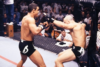 SAO PAULO, BRAZIL - OCTOBER 16:  (L-R) Vitor Belfort rushes Wanderlei Silva after a series of punches during their middleweight fight at UFC Ultimate Brazil on October 16, 1998 in Sao Paulo, Brazil.  (Photo by Zuffa LLC/Zuffa LLC via Getty Images)
