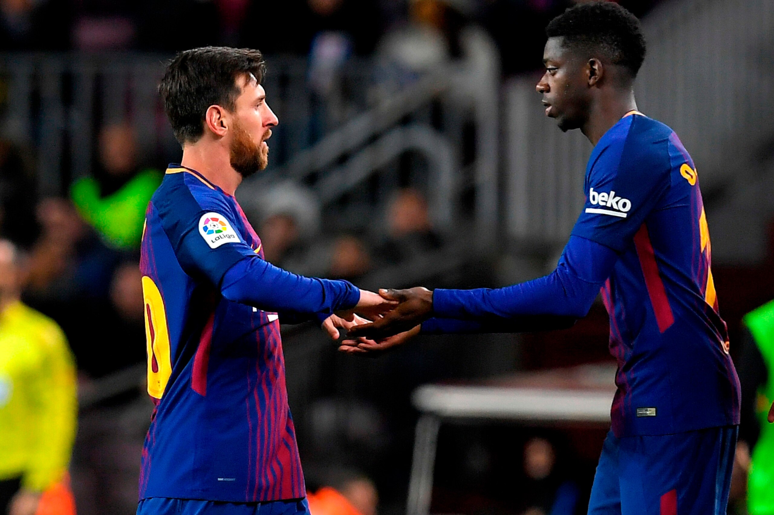 Barcelona's Argentinian forward Lionel Messi (L) is replaced by Barcelona's French forward Ousmane Dembele during the Spanish Copa del Rey (King's Cup) round of 16 second leg football match FC Barcelona vs RC Celta de Vigo at the Camp Nou stadium in Barce Barcelona's Argentinian forward Lionel Messi (L) is replaced by Barcelona's French forward Ousmane Dembele during the Spanish Copa del Rey (King's Cup) round of 16 second leg football match FC Barcelona vs RC Celta de Vigo at the Camp Nou stadium in Barce