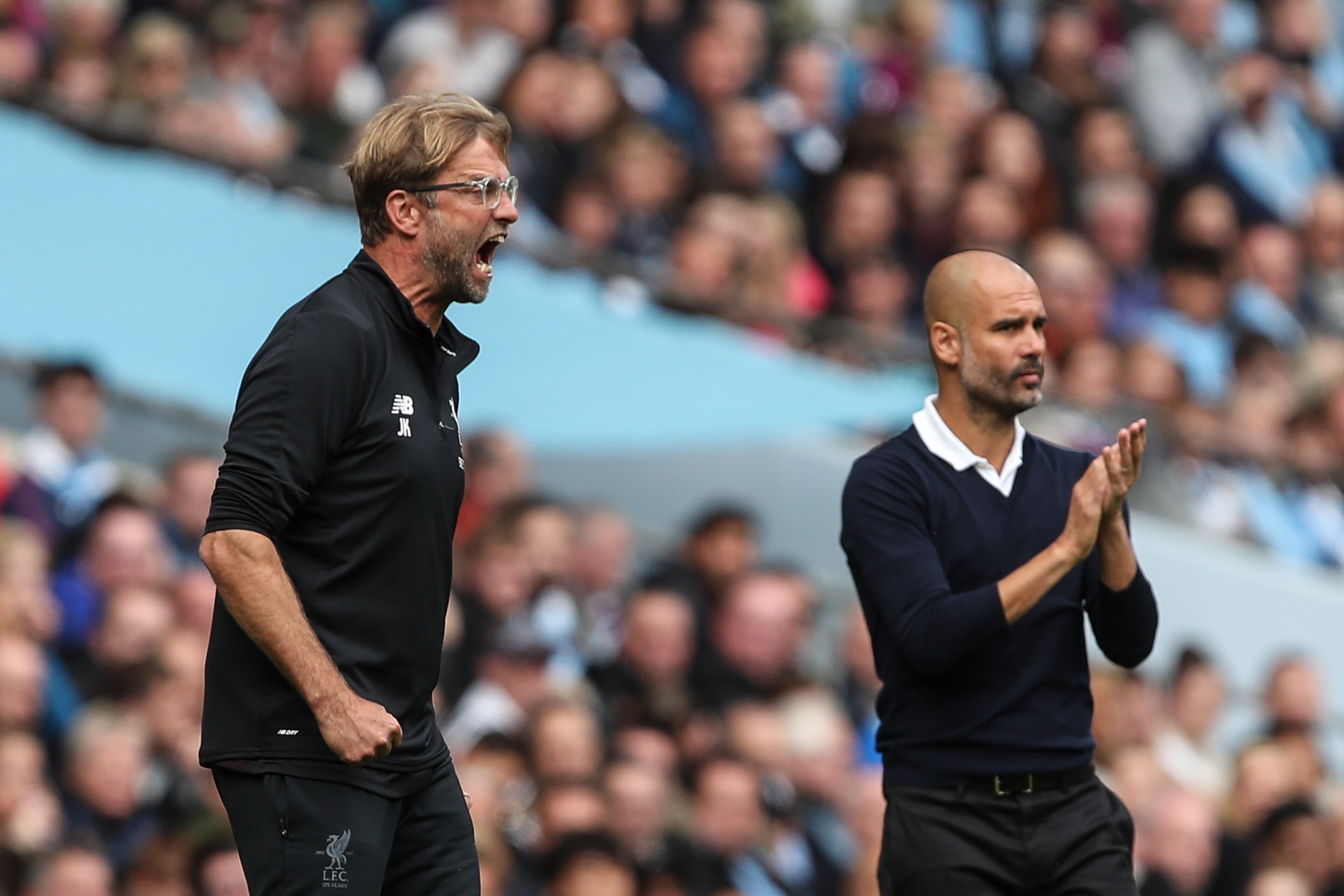 MANCHESTER, ENGLAND - SEPTEMBER 09: Jurgen Klopp manager / head coach of Liverpool and Pep Guardiola the head coach / manager of Manchester City during the Premier League match between Manchester City and Liverpool at Etihad Stadium on September 9, 2017 i