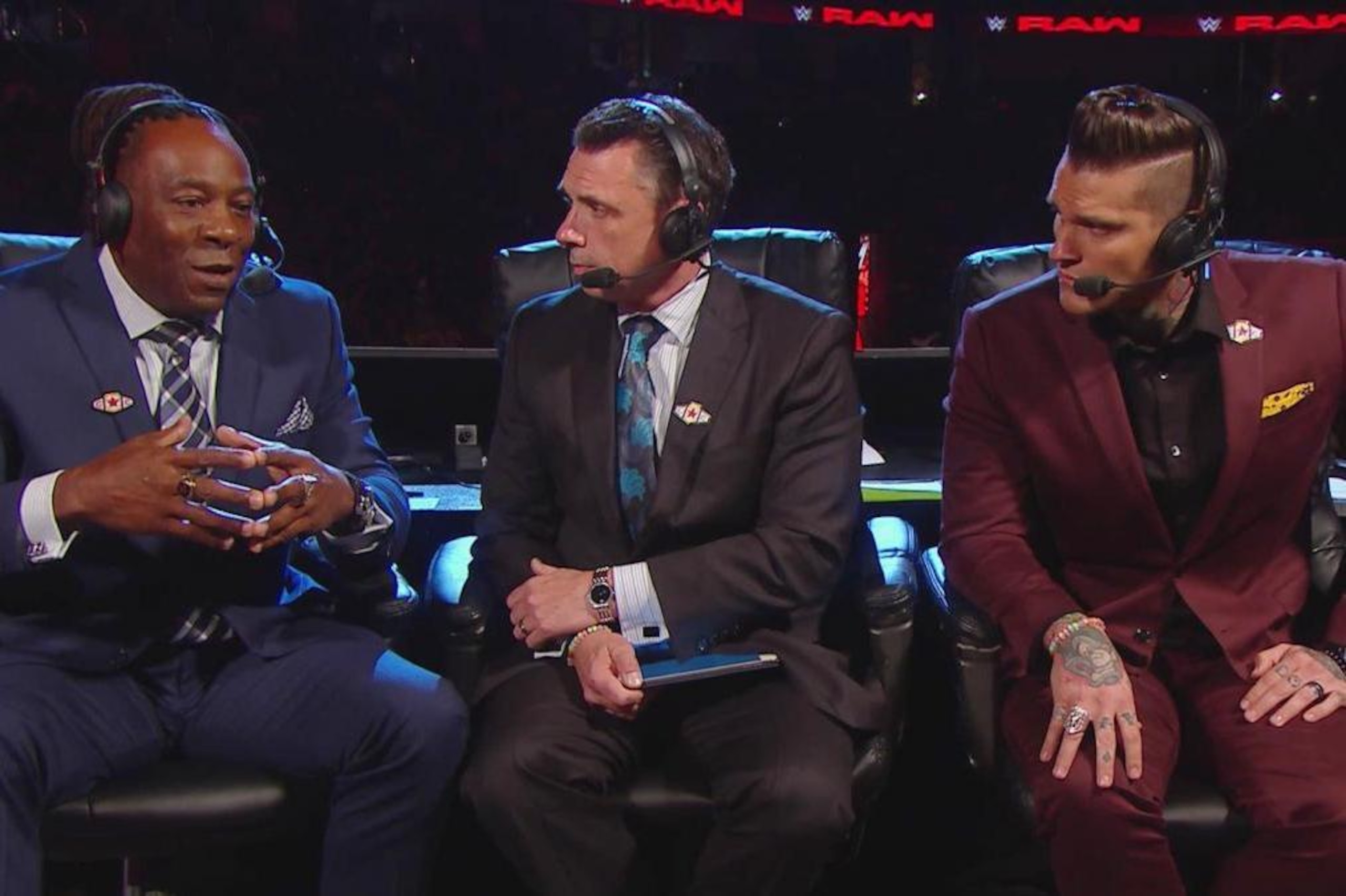 Booker T, Michael Cole and Corey Graves