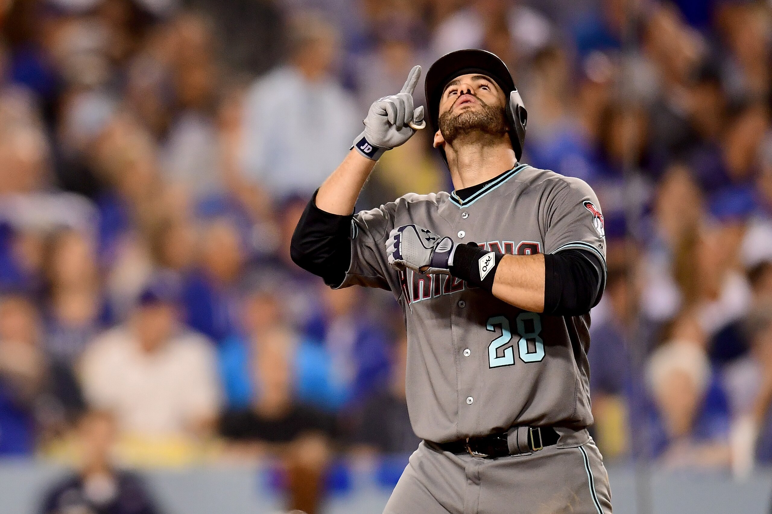 LOS ANGELES, CA - OCTOBER 06:  J.D. Martinez #28 of the Arizona Diamondbacks celebrates after hitting a solo home run in the sixth inning against the Los Angeles Dodgers in game one of the National League Division Series at Dodger Stadium on October 6, 20