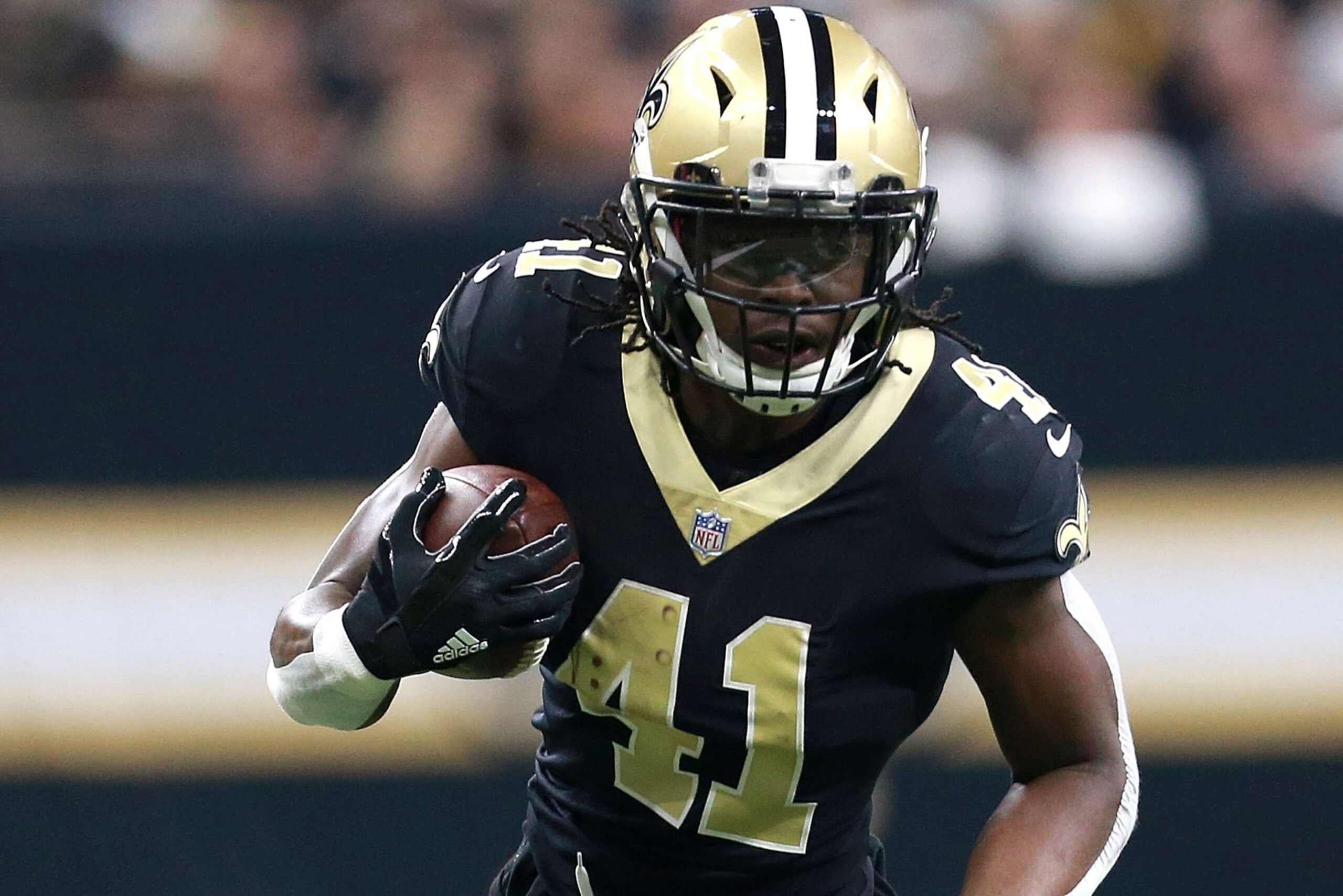NEW ORLEANS, LA - JANUARY 07:  Alvin Kamara #41 of the New Orleans Saints runs the ball during the first half of the NFC Wild Card playoff against the Carolina Panthers game at the Mercedes-Benz Superdome on January 7, 2018 in New Orleans, Louisiana.  (Ph