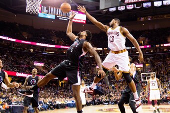 CLEVELAND, OH - JANUARY 21:DeAndre Jordan #6 of the Los Angeles Clippers fights for a rebound with Tristan Thompson #13 of the Cleveland Cavaliers during the second half at Quicken Loans Arena on January 21, 2016 in Cleveland, Ohio. The Cavaliers defeated