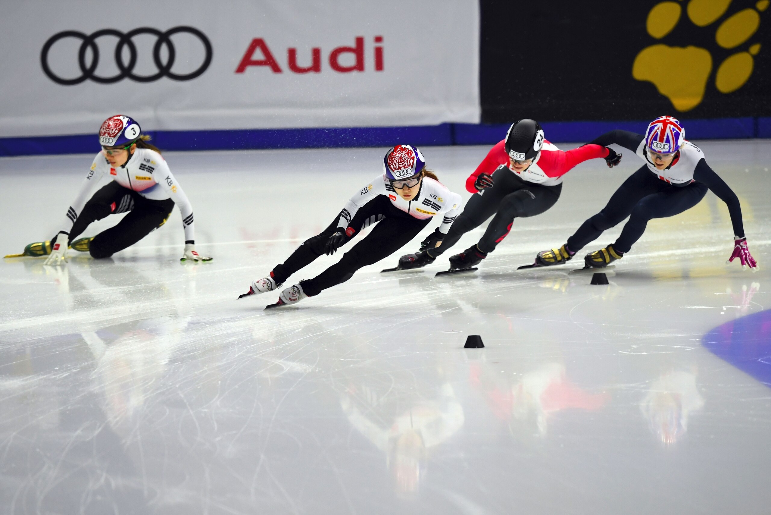 Choi Min-Jeong (2nd L) of South Korea, Kim Boutin (2nd R) of Canada and Elise Christie (R) of Great Britain compete as Shim Suk-Hee (L) of South Korea falls during the women's 1000m final event at the ISU World Cup Short Track Speed Skating in Seoul on No