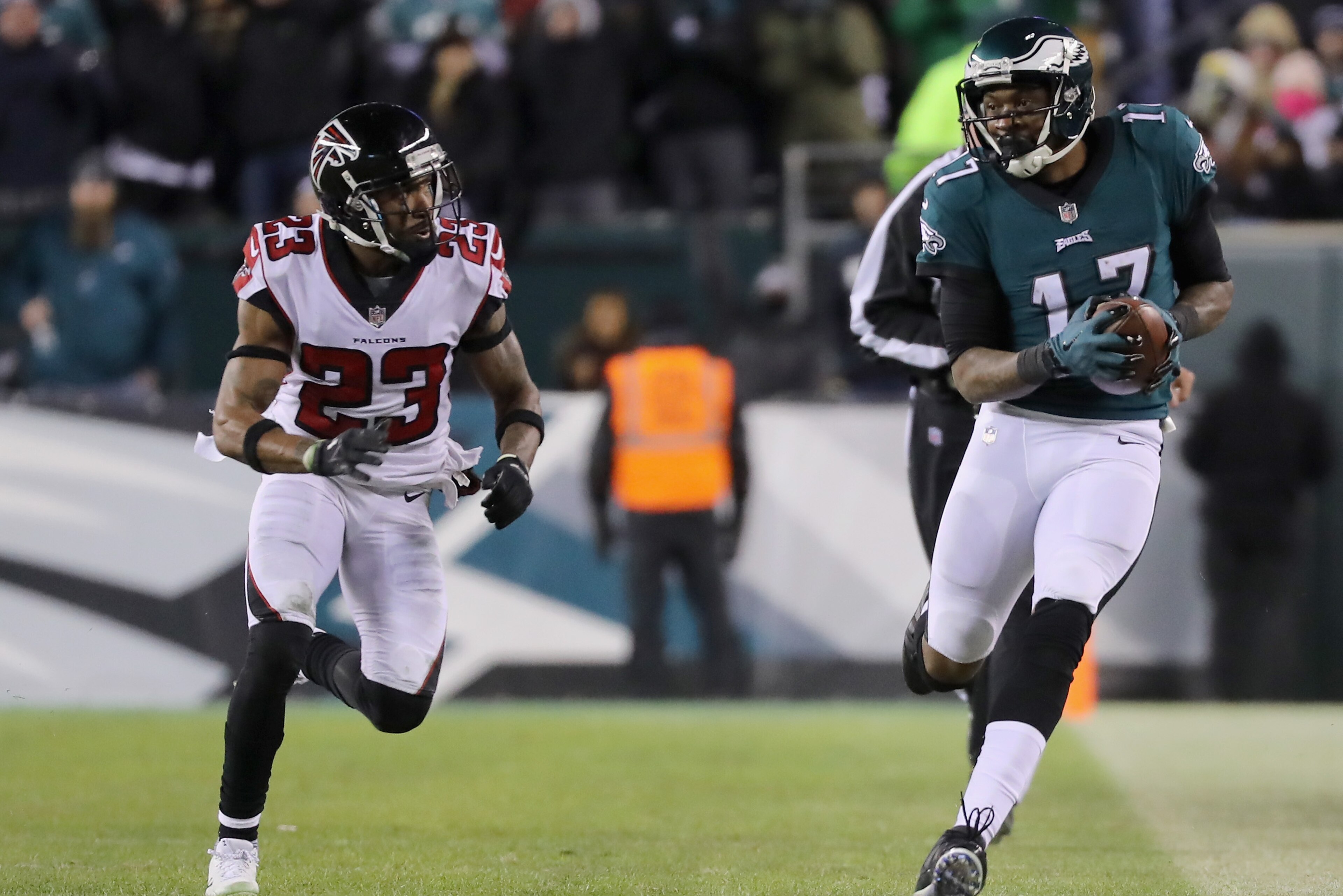 PHILADELPHIA, PA - JANUARY 13: Wide receiver Alshon Jeffery #17 of the Philadelphia Eagles runs the ball against cornerback Robert Alford #23 of the Atlanta Falcons during the third quarter in the NFC Divisional Playoff game at Lincoln Financial Field on 