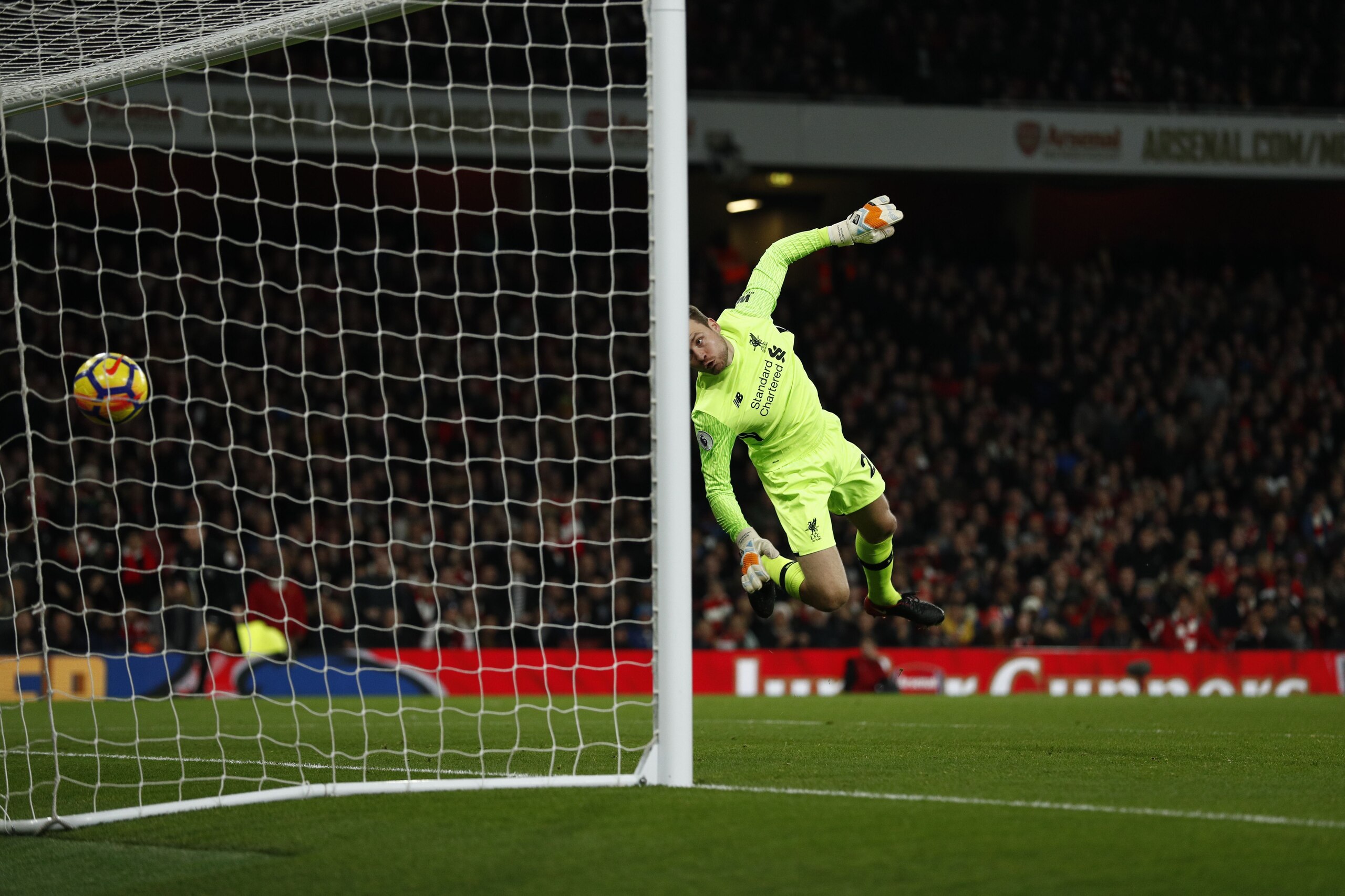 Arsenal's Swiss midfielder Granit Xhaka (unseen) scores past Liverpool's Belgian goalkeeper Simon Mignolet during the English Premier League football match between Arsenal and Liverpool at the Emirates Stadium in London on December 22, 2017.  / AFP PHOTO 