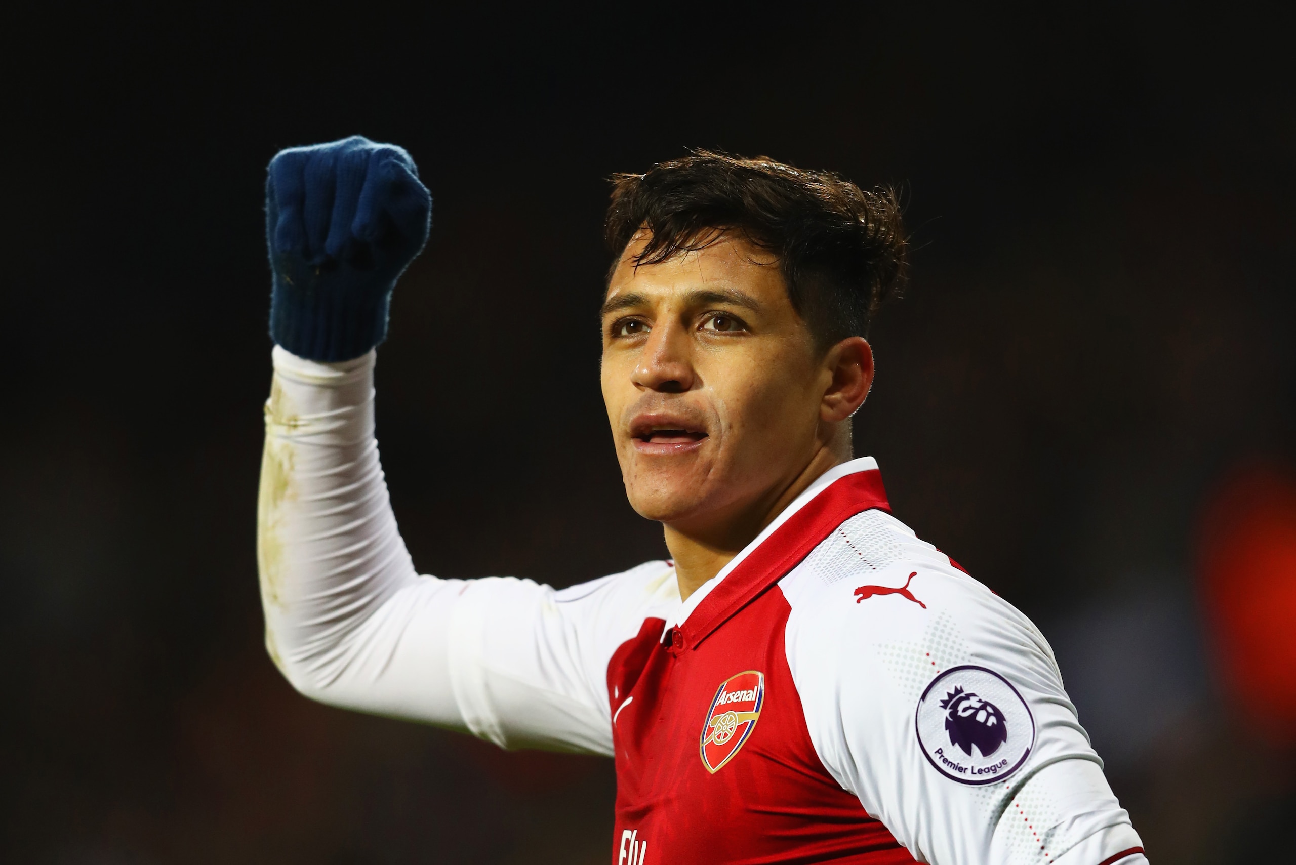 WEST BROMWICH, ENGLAND - DECEMBER 31:  Alexis Sanchez of Arsenal celebrates as his free kick deflects off James McClean of West Bromwich Albion for their first goal during the Premier League match between West Bromwich Albion and Arsenal at The Hawthorns 