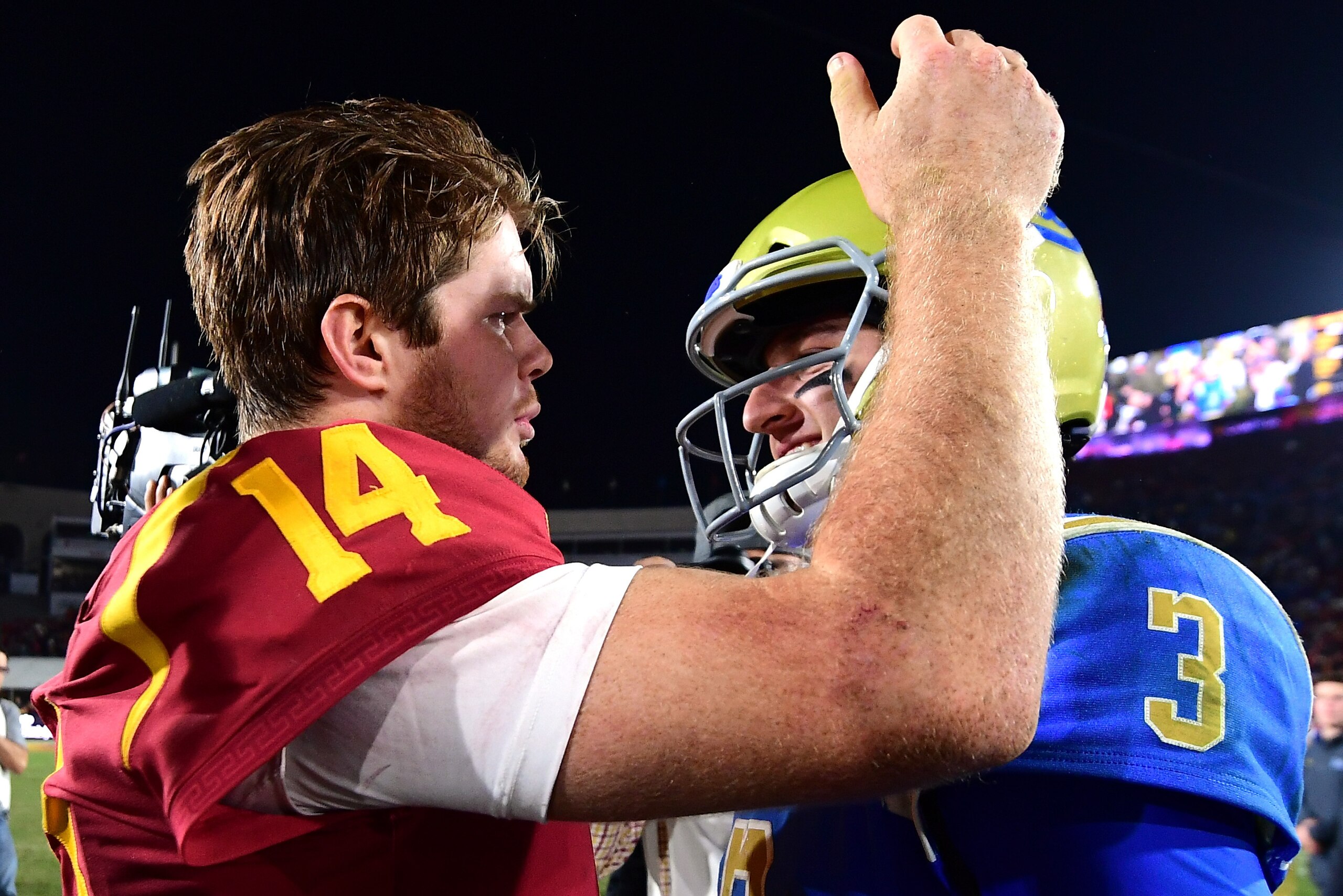 LOS ANGELES, CA - NOVEMBER 18:  Josh Rosen #3 of the UCLA Bruins and Sam Darnold #14 of the USC Trojans meet on the field after a 28-23 Trojan win at Los Angeles Memorial Coliseum on November 18, 2017 in Los Angeles, California.  (Photo by Harry How/Getty