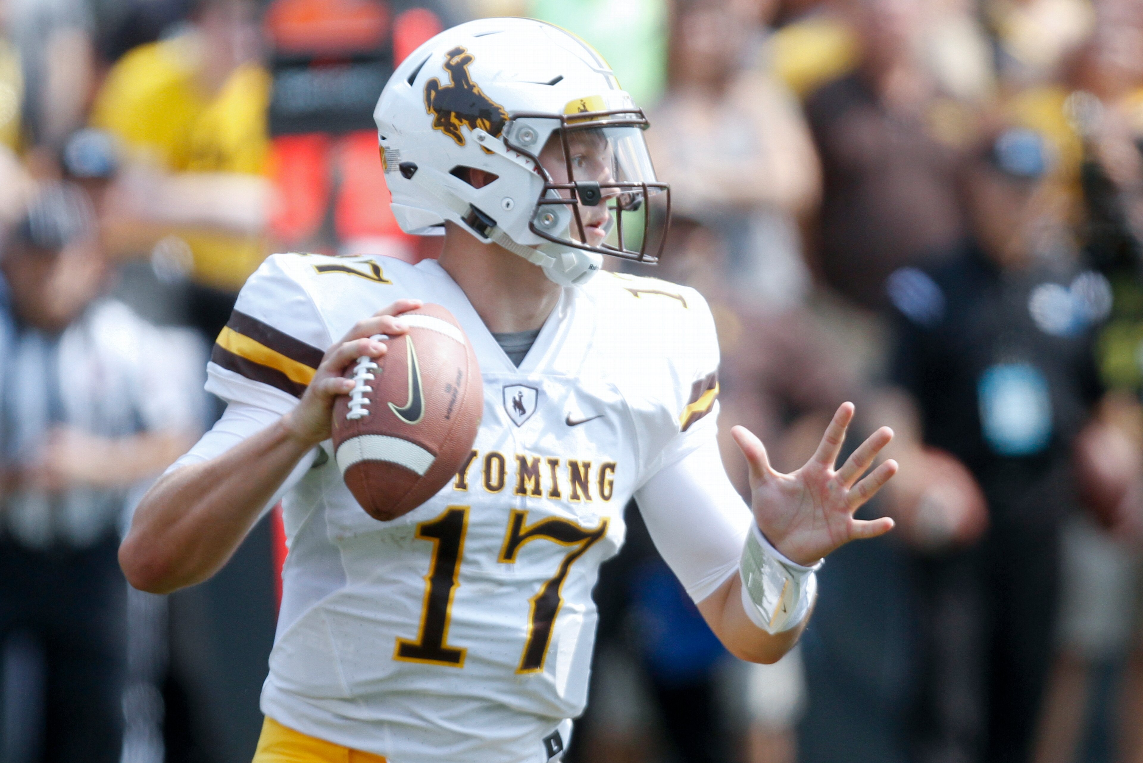 IOWA CITY, IOWA- SEPTEMBER 2:  Quarterback Josh Allen #17 of the Wyoming Cowboys looks for a receiver in the third quarter against the Iowa Hawkeyes, on September 2, 2017 at Kinnick Stadium in Iowa City, Iowa.  (Photo by Matthew Holst/Getty Images)