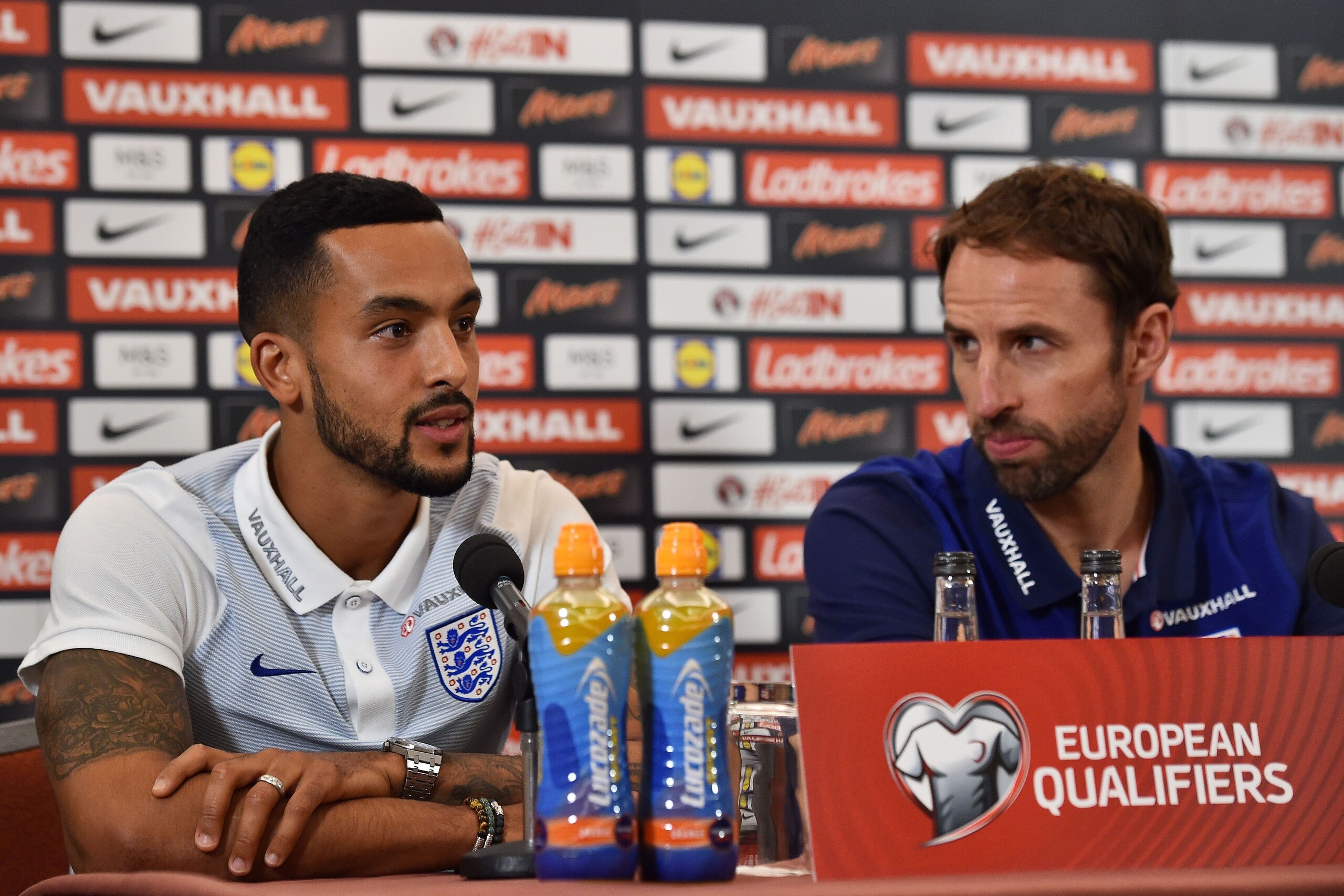 England's Interim manager Gareth Southgate (R) looks over as England's striker Theo Walcott (L) answers a question during a press conference at Sopwell House hotel, north of London on October 7, 2016, ahead of England's 2018 World Cup qualifying football 