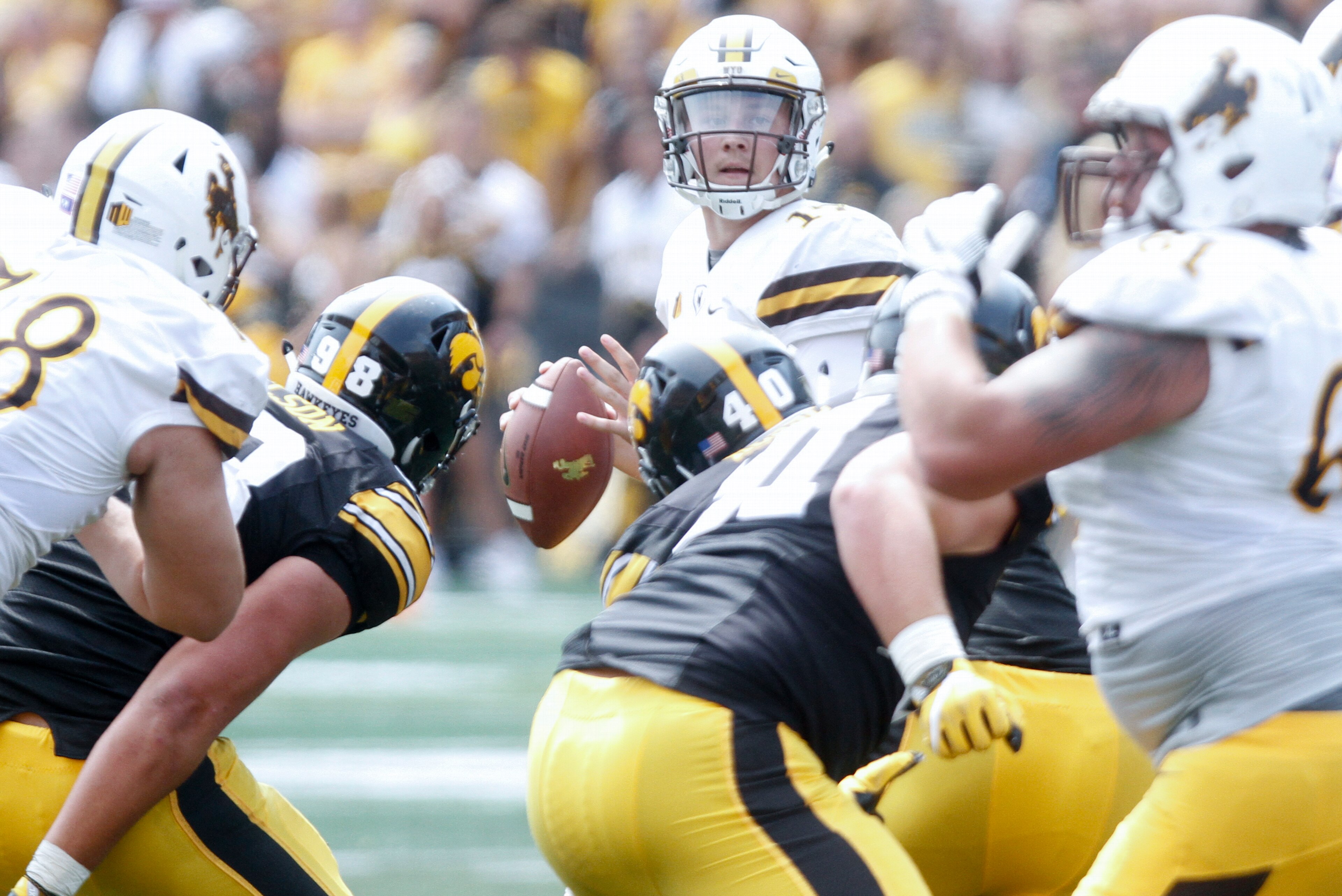 IOWA CITY, IOWA- SEPTEMBER 2:  Quarterback Josh Allen #17 of the Wyoming Cowboys looks for a receiver in the fourth quarter against the Iowa Hawkeyes, on September 2, 2017 at Kinnick Stadium in Iowa City, Iowa.  (Photo by Matthew Holst/Getty Images)
