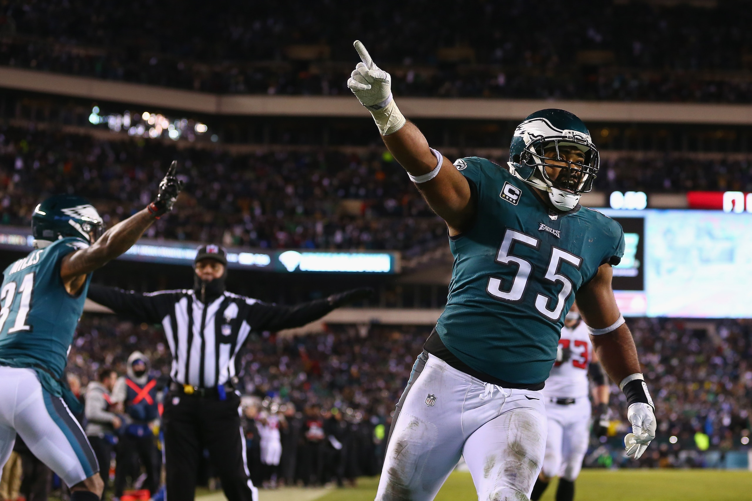 PHILADELPHIA, PA - JANUARY 13: Defensive end Brandon Graham #55 and cornerback Jalen Mills #31 of the Philadelphia Eagles celebrate against the Atlanta Falcons during the fourth quarter in the NFC Divisional Playoff game at Lincoln Financial Field on Janu PHILADELPHIA, PA - JANUARY 13: Defensive end Brandon Graham #55 and cornerback Jalen Mills #31 of the Philadelphia Eagles celebrate against the Atlanta Falcons during the fourth quarter in the NFC Divisional Playoff game at Lincoln Financial Field on Janu