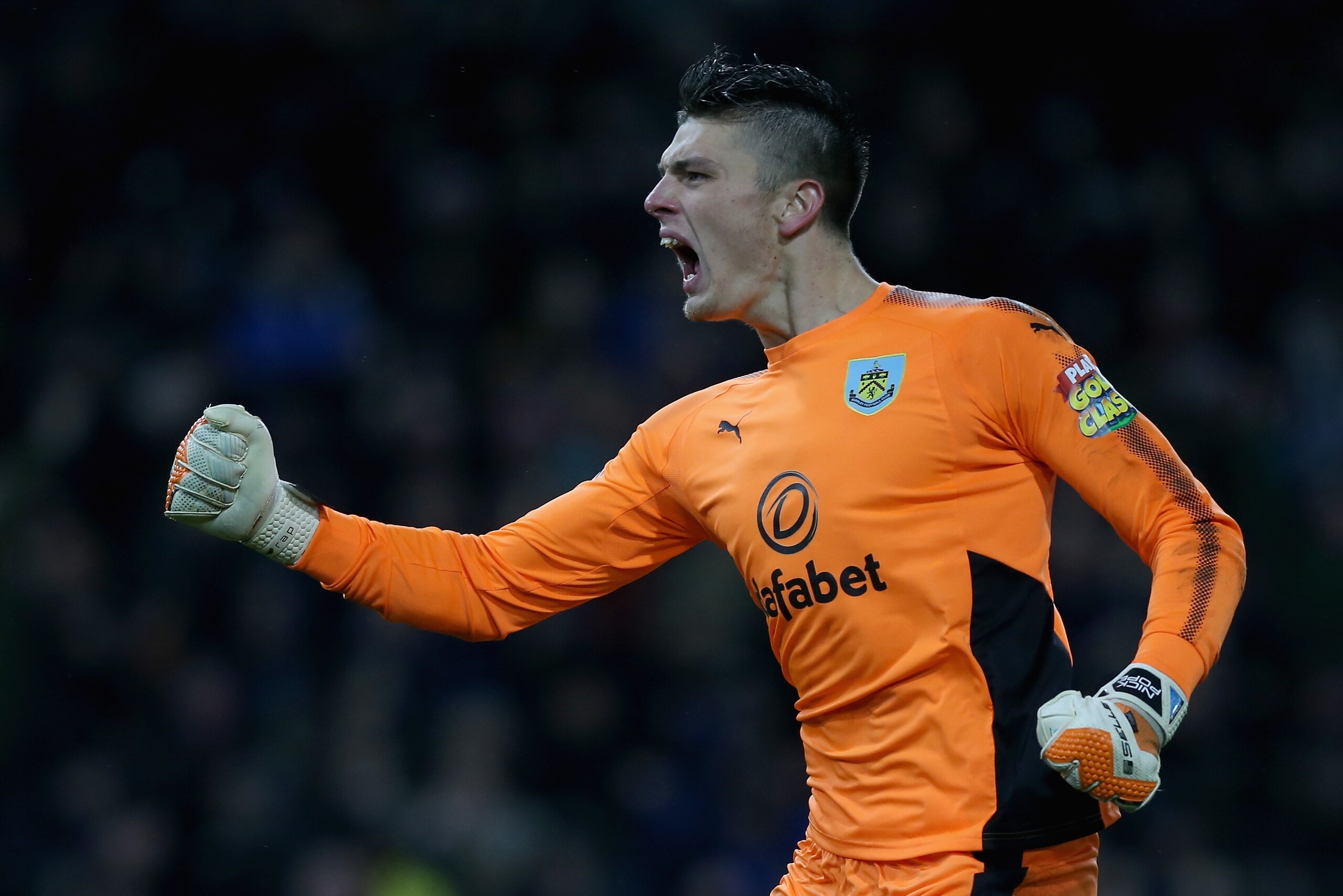 BURNLEY, ENGLAND - JANUARY 01: Nick Pope of Burnley celebrates his sides first goal during the Premier League match between Burnley and Liverpool at Turf Moor on January 1, 2018 in Burnley, England.  (Photo by Nigel Roddis/Getty Images)