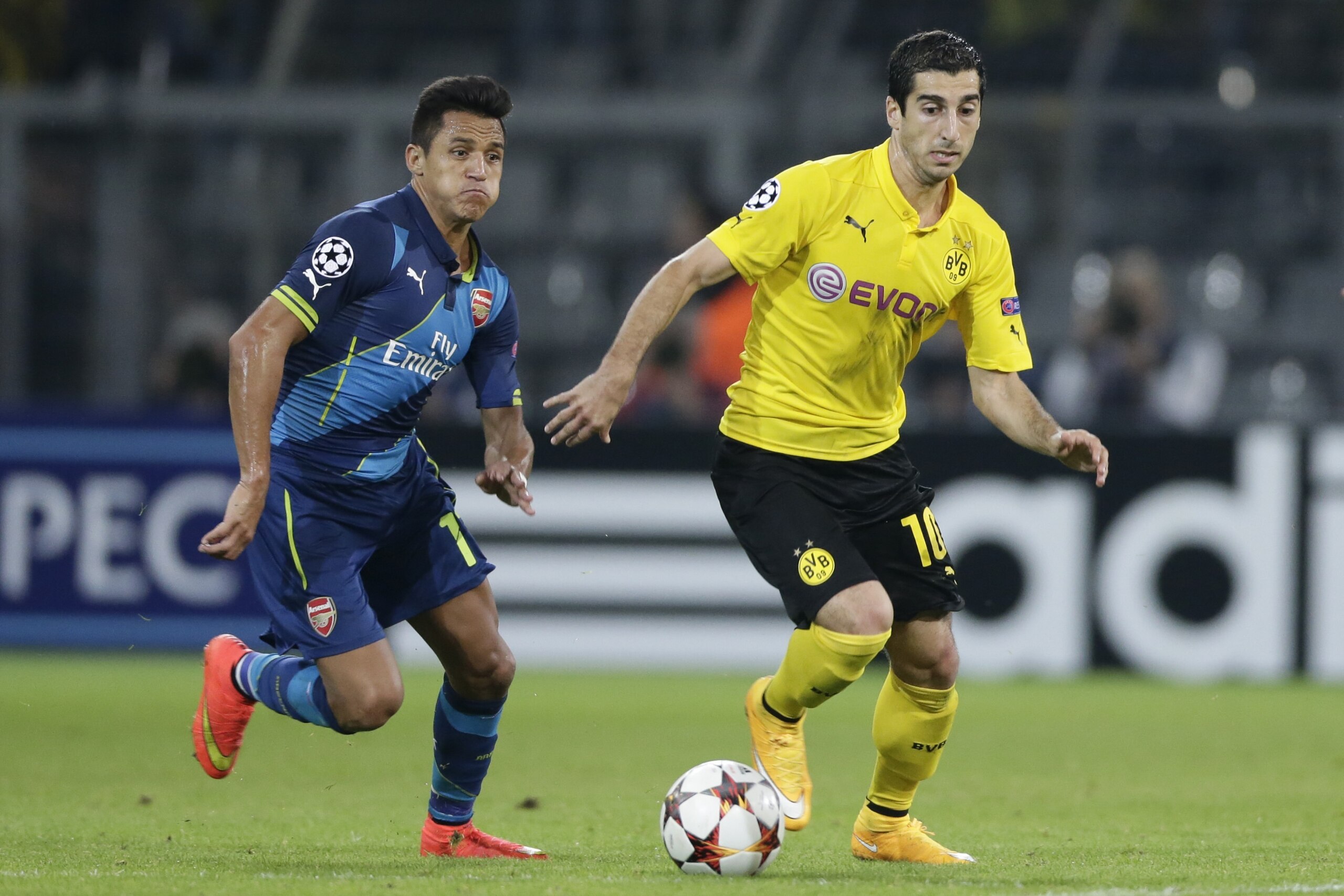 (L-R) Alexis Sanchez of Arsenal FC, Henrikh Mkhitaryan of Borussia Dortmund during the UEFA Champions League group D match between Borussia Dortmund and Arsenal on September 16, 2014 at the Signal Iduna Park stadium in Dortmund, Germany.(Photo by VI Image