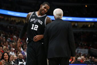 CHICAGO, IL - OCTOBER 21:  LaMarcus Aldridge #12 of the San Antonio Spurs meets with head coach Gregg Popovich of the San Antonio Spurs in the fourth quarter against the Chicago Bulls at the United Center on October 21, 2017 in Chicago, Illinois. NOTE TO 