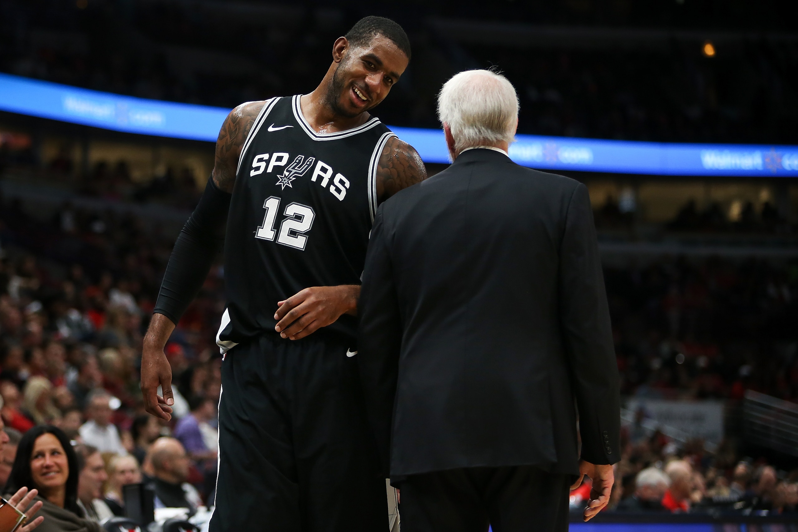 CHICAGO, IL - OCTOBER 21:  LaMarcus Aldridge #12 of the San Antonio Spurs meets with head coach Gregg Popovich of the San Antonio Spurs in the fourth quarter against the Chicago Bulls at the United Center on October 21, 2017 in Chicago, Illinois. NOTE TO 