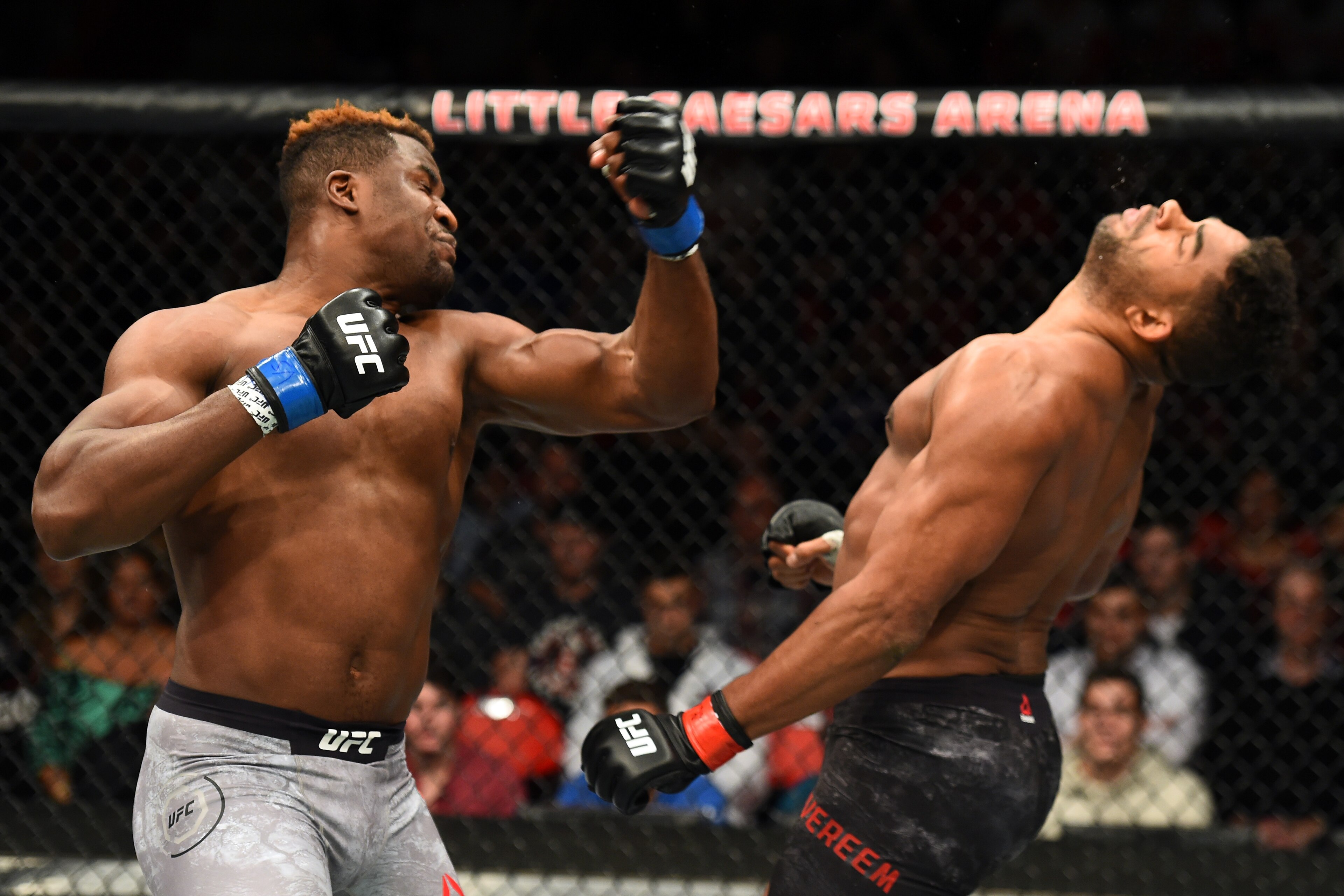 DETROIT, MI - DECEMBER 02:  (L-R) Francis Ngannou of Cameroon punches Alistair Overeem of The Netherlands in their heavyweight bout during the UFC 218 event inside Little Caesars Arena on December 02, 2017 in Detroit, Michigan. (Photo by Josh Hedges/Zuffa