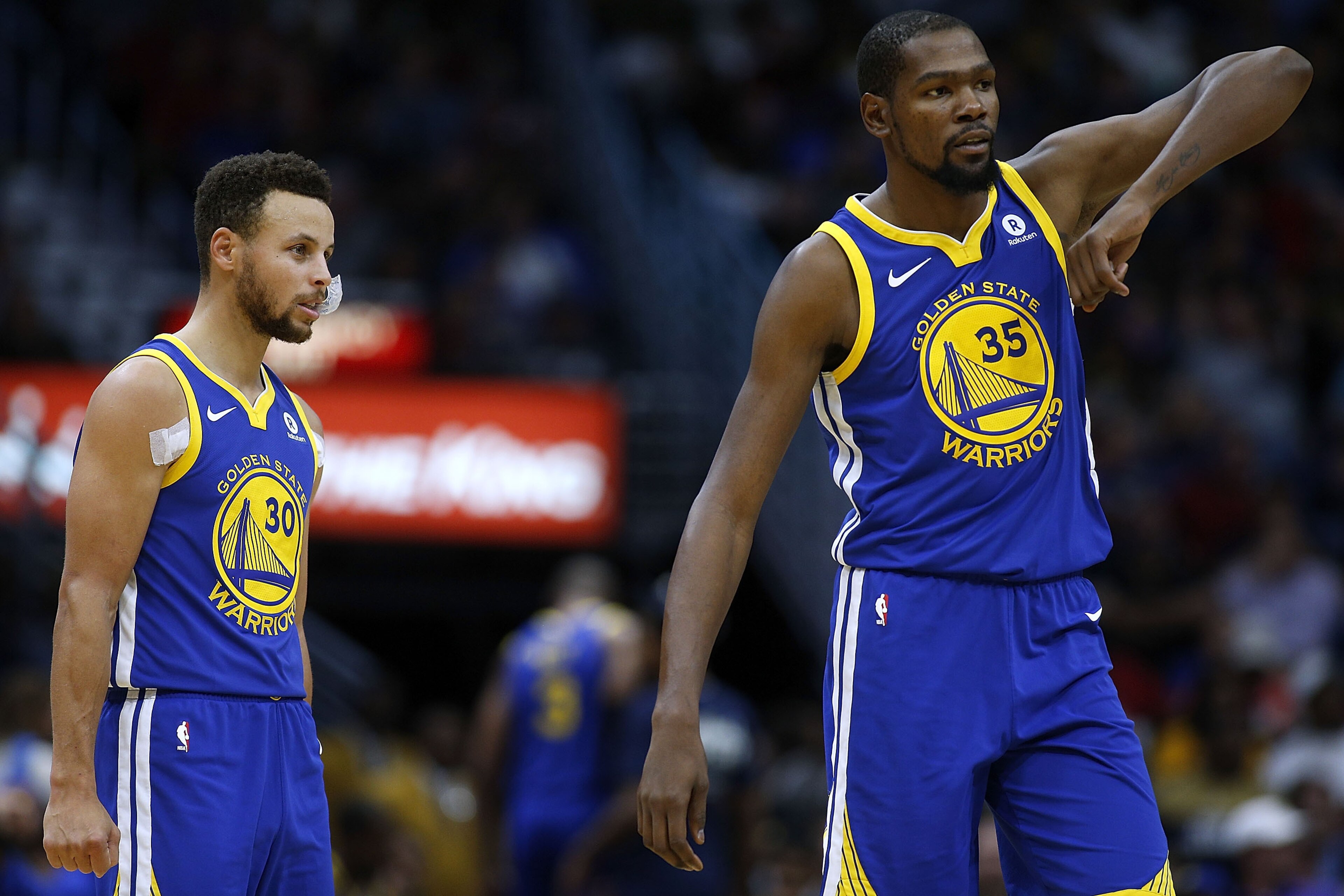NEW ORLEANS, LA - DECEMBER 04:  Kevin Durant #35 of the Golden State Warriors and Stephen Curry #30 react during the first half of a game against the New Orleans Pelicans at the Smoothie King Center on December 4, 2017 in New Orleans, Louisiana. NOTE TO U