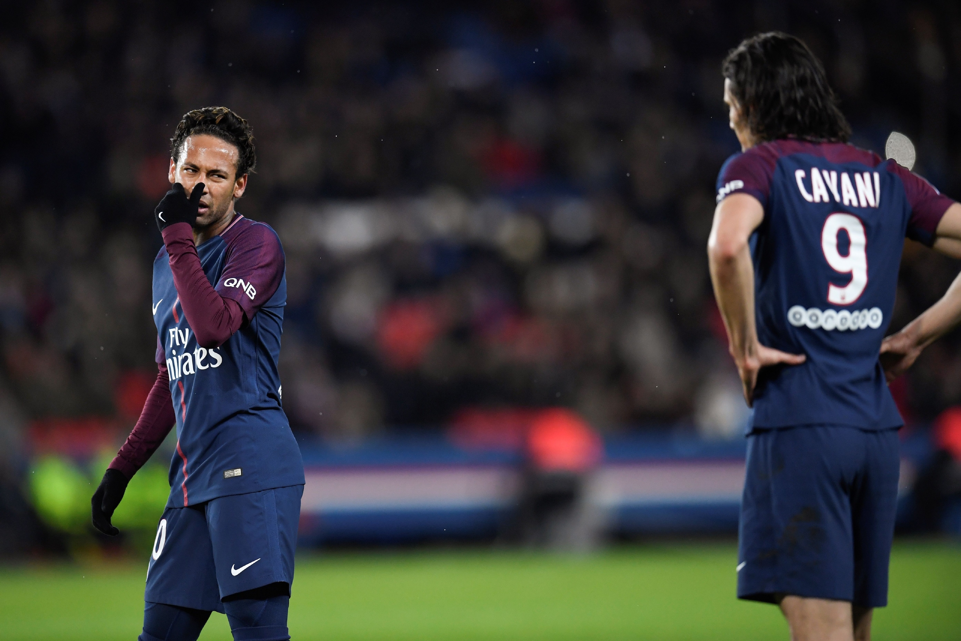 Paris Saint-Germain's Brazilian forward Neymar (L) talks to Paris Saint-Germain's Uruguayan forward Edinson Cavani prior to shooting a free-kick during the French L1 football match between Paris Saint-German and Dijon on January 17, 2018 at the Parc des P Paris Saint-Germain's Brazilian forward Neymar (L) talks to Paris Saint-Germain's Uruguayan forward Edinson Cavani prior to shooting a free-kick during the French L1 football match between Paris Saint-German and Dijon on January 17, 2018 at the Parc des P