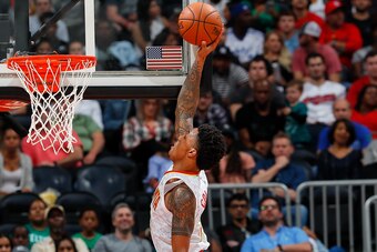 ATLANTA, GA - NOVEMBER 06:  John Collins #20 of the Atlanta Hawks attempts a dunk against Daniel Theis #27 of the Boston Celtics at Philips Arena on November 6, 2017 in Atlanta, Georgia.  NOTE TO USER: User expressly acknowledges and agrees that, by downl