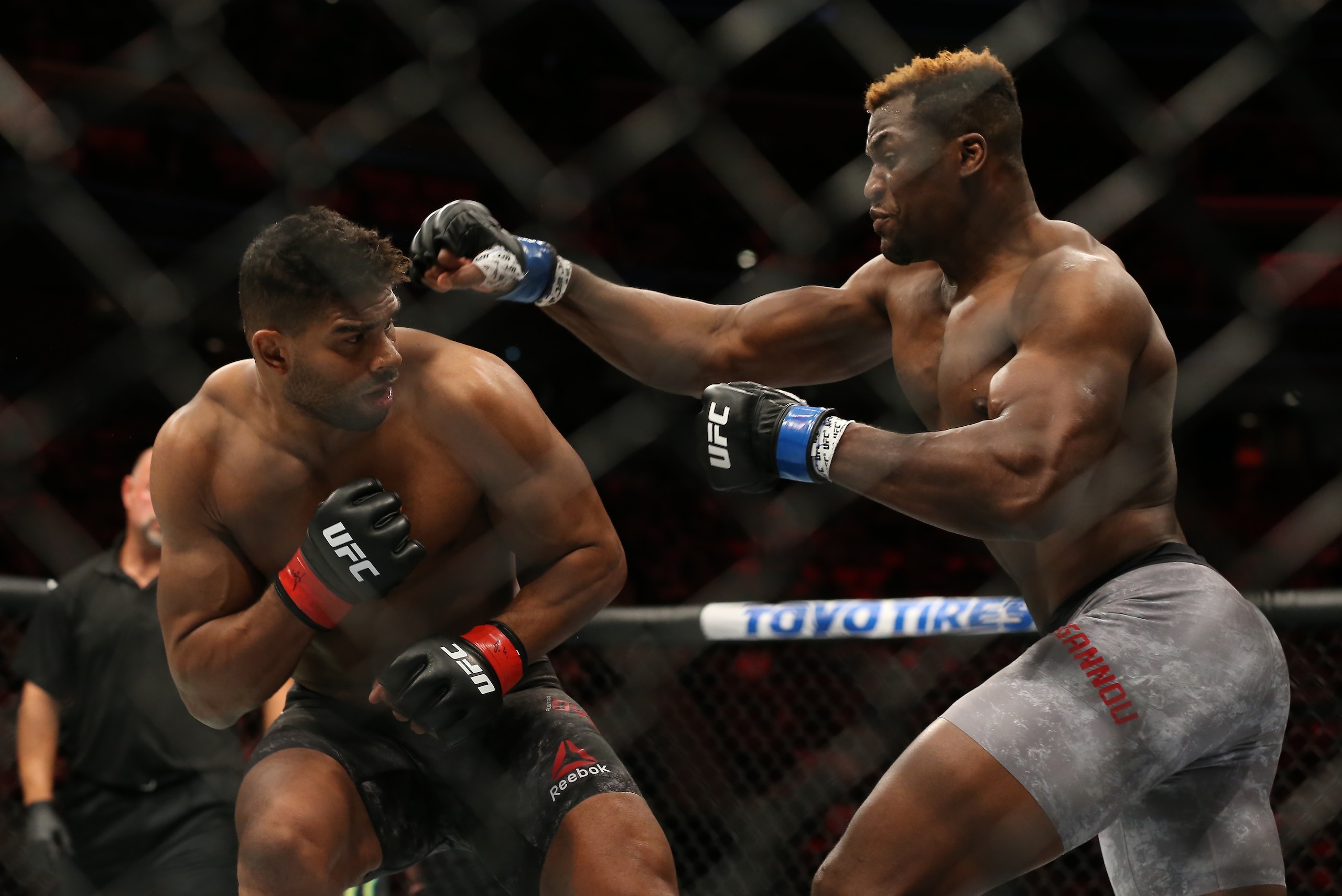 DETROIT, MI - DECEMBER 2:  Francis Ngannou (R) punches Alistair Overeem during the UFC 218 event at Little Caesars Arena on December 2, 2017 in Detroit, Michigan. (Photo by Rey Del Rio/Zuffa LLC via Getty Images)