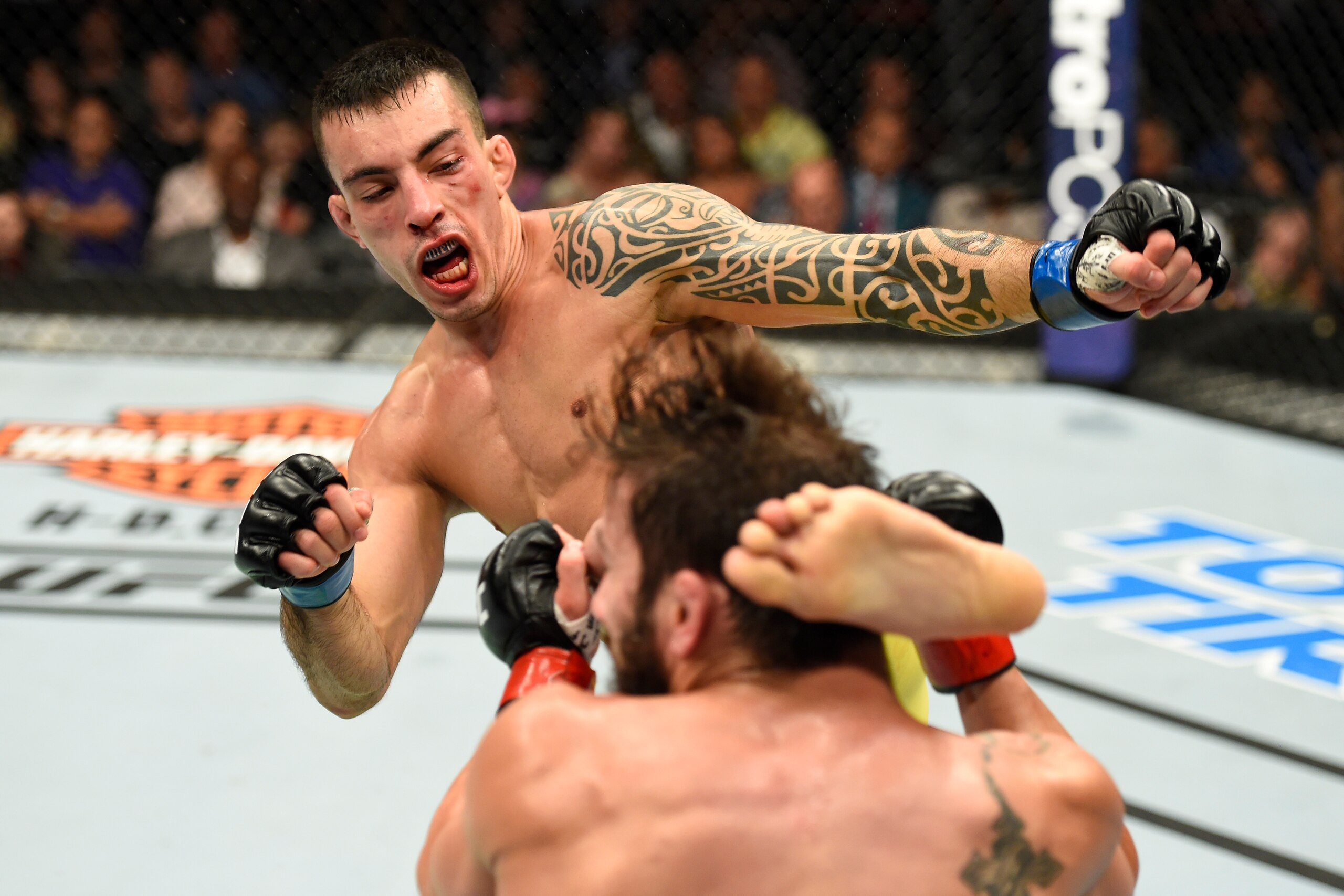UNIONDALE, NY - JULY 22:  (L-R) Thomas Almeida of Brazil kicks Jimmie Rivera in their bantamweight bout during the UFC Fight Night event inside the Nassau Veterans Memorial Coliseum on July 22, 2017 in Uniondale, New York. (Photo by Josh Hedges/Zuffa LLC/