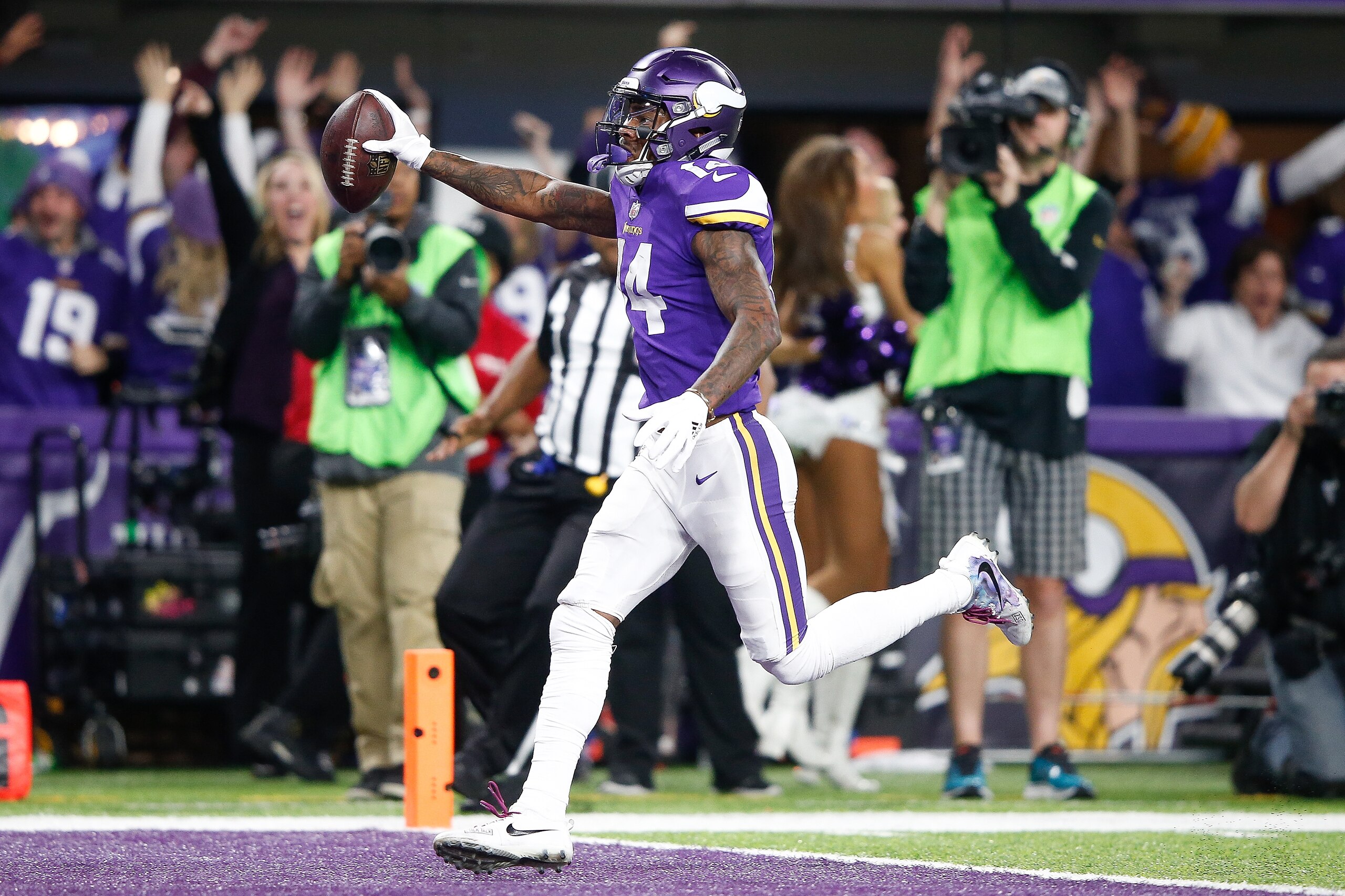 MINNEAPOLIS, MN - JANUARY 14:  Stefon Diggs #14 of the Minnesota Vikings scores a touchdown as time expires against the New Orleans Saints during the second half of the NFC Divisional Playoff game at U.S. Bank Stadium on January 14, 2018 in Minneapolis, M