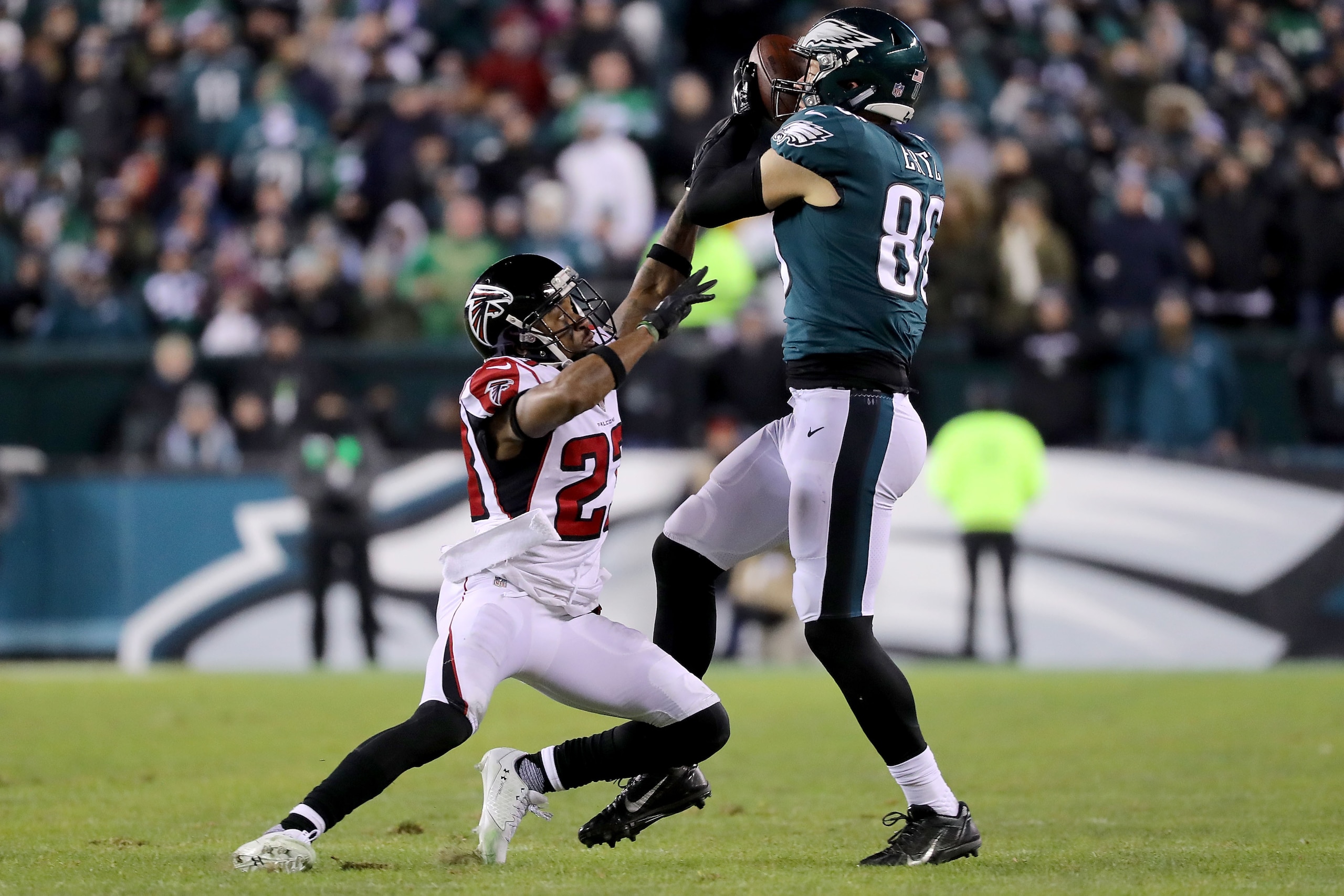 PHILADELPHIA, PA - JANUARY 13:  Robert Alford #23 of the Atlanta Falcons attempts to break up a pass to Zach Ertz #86 of the Philadelphia Eagles in the second half during the NFC Divisional Playoff game game at Lincoln Financial Field on January 13, 2018 